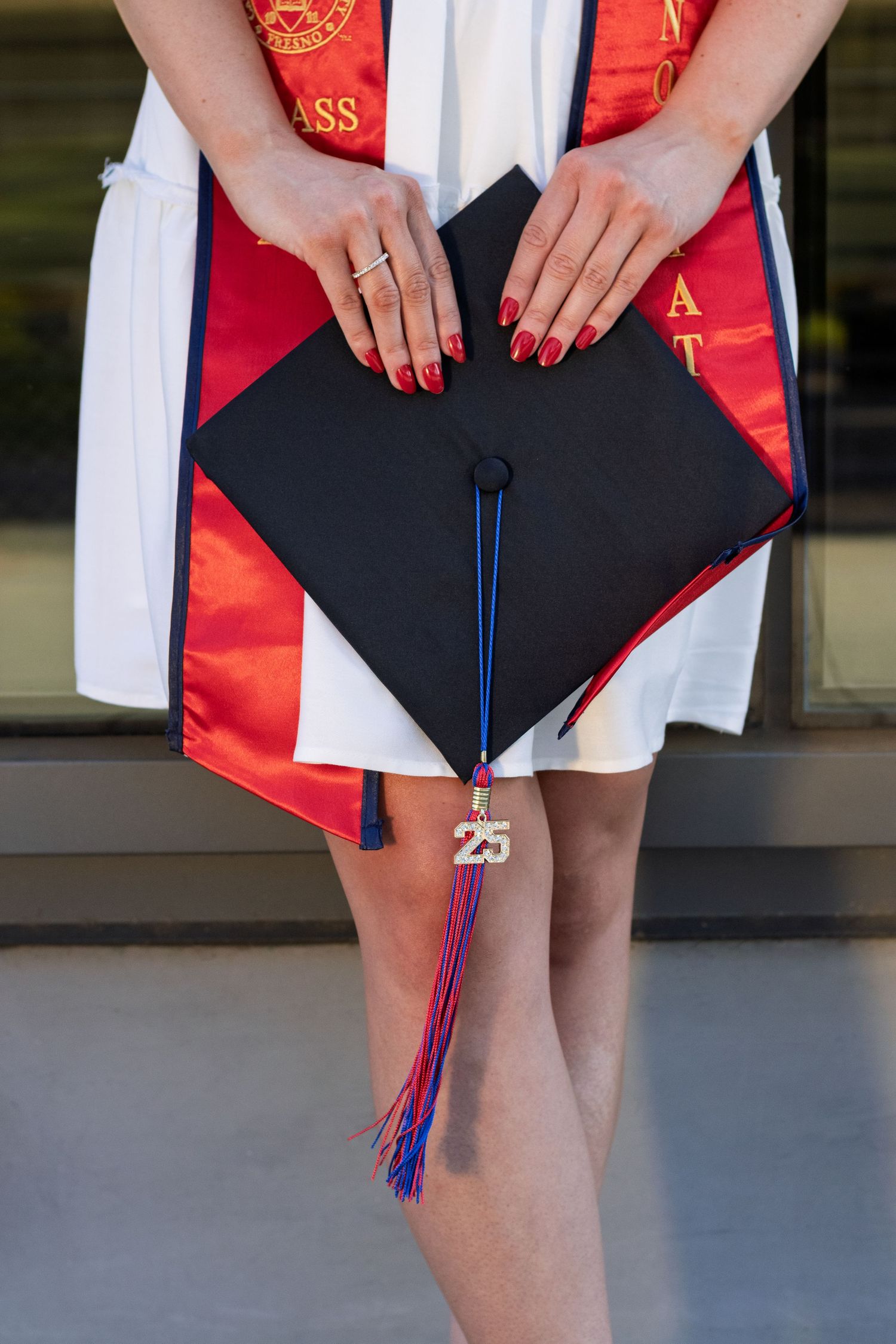 Candid graduation cap details photographed during golden hour in Fresno State