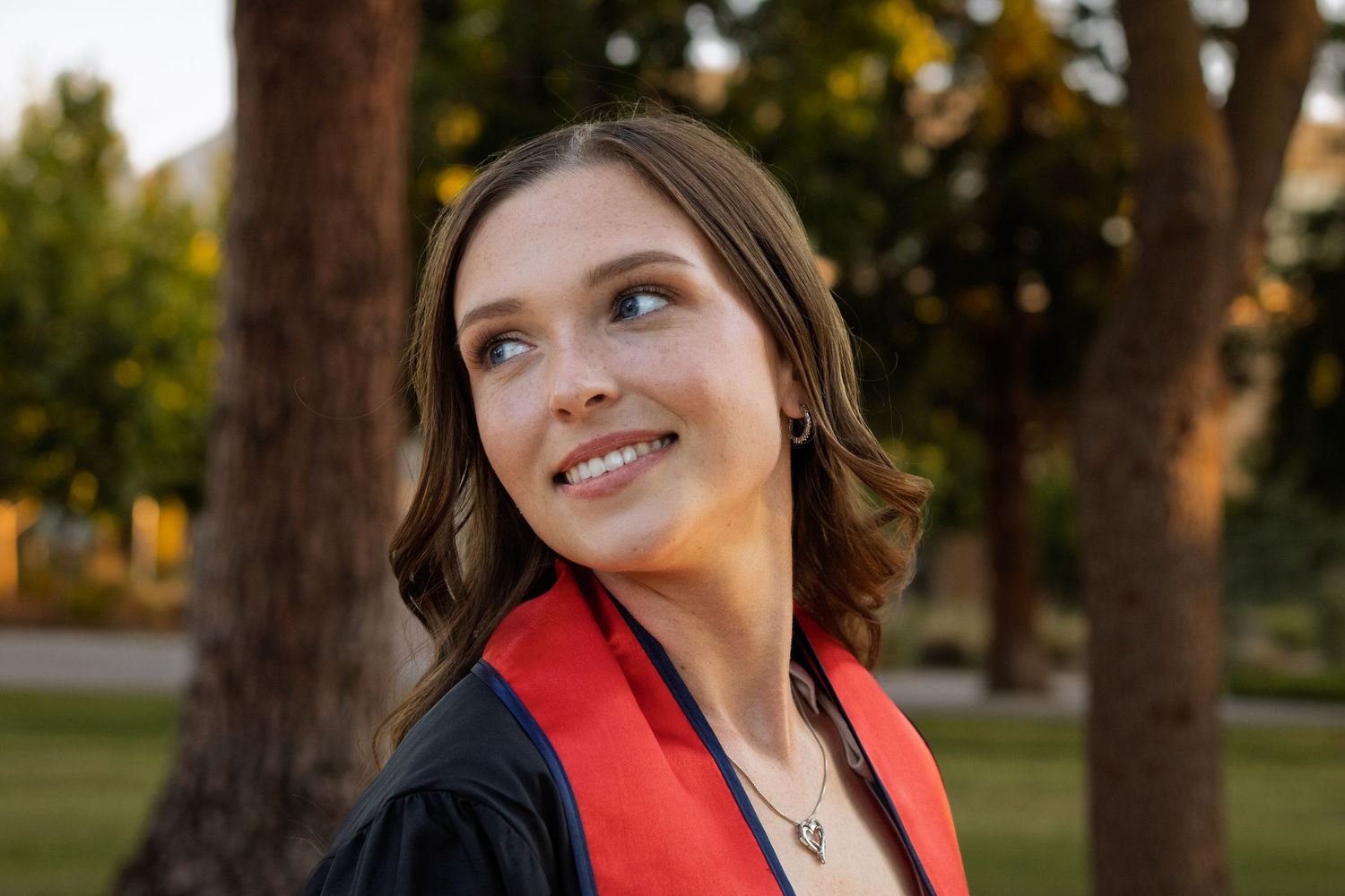 Graduation portrait at sunset with warm natural light