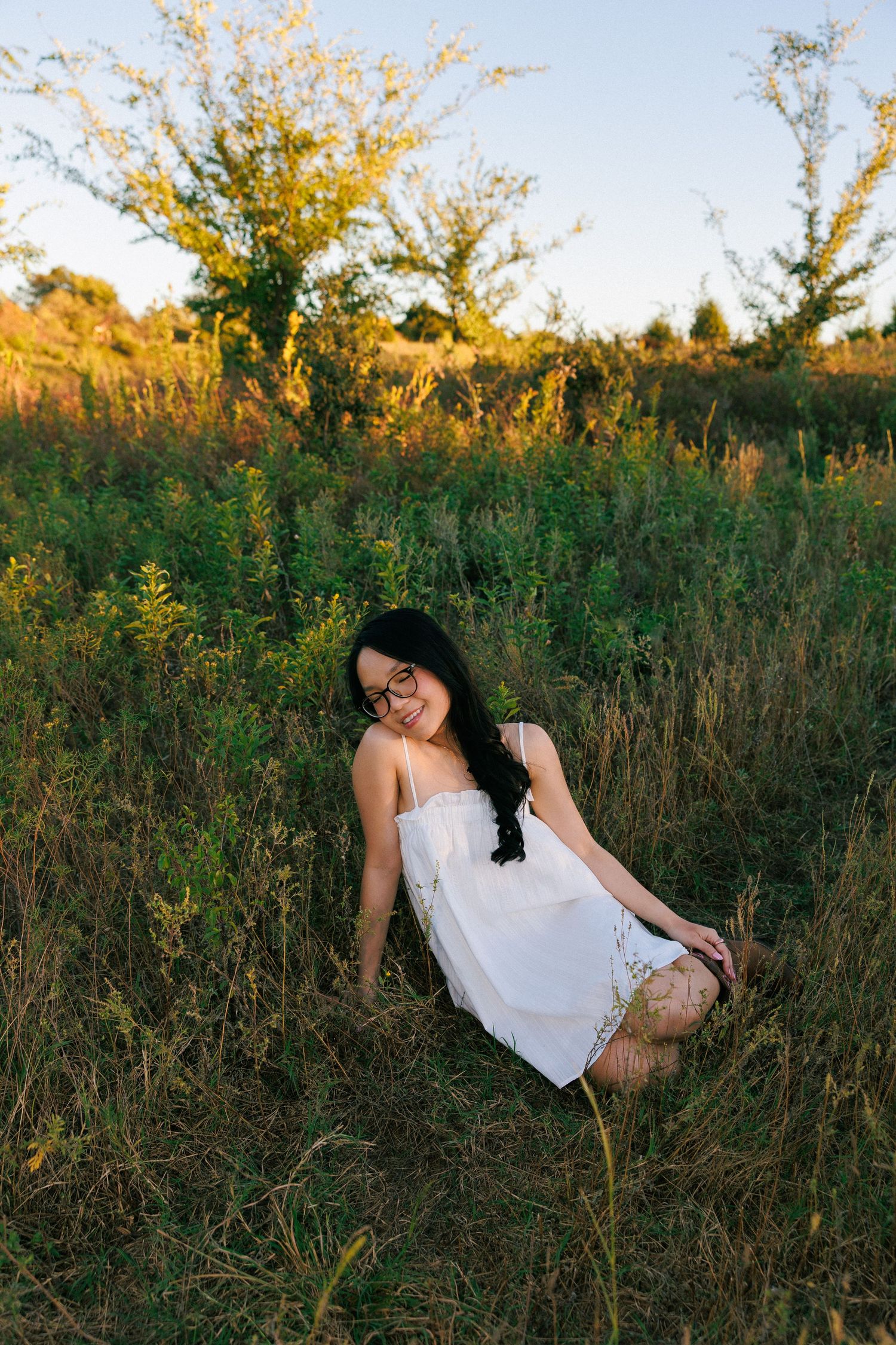 A white sundress in a golden field at sunset.