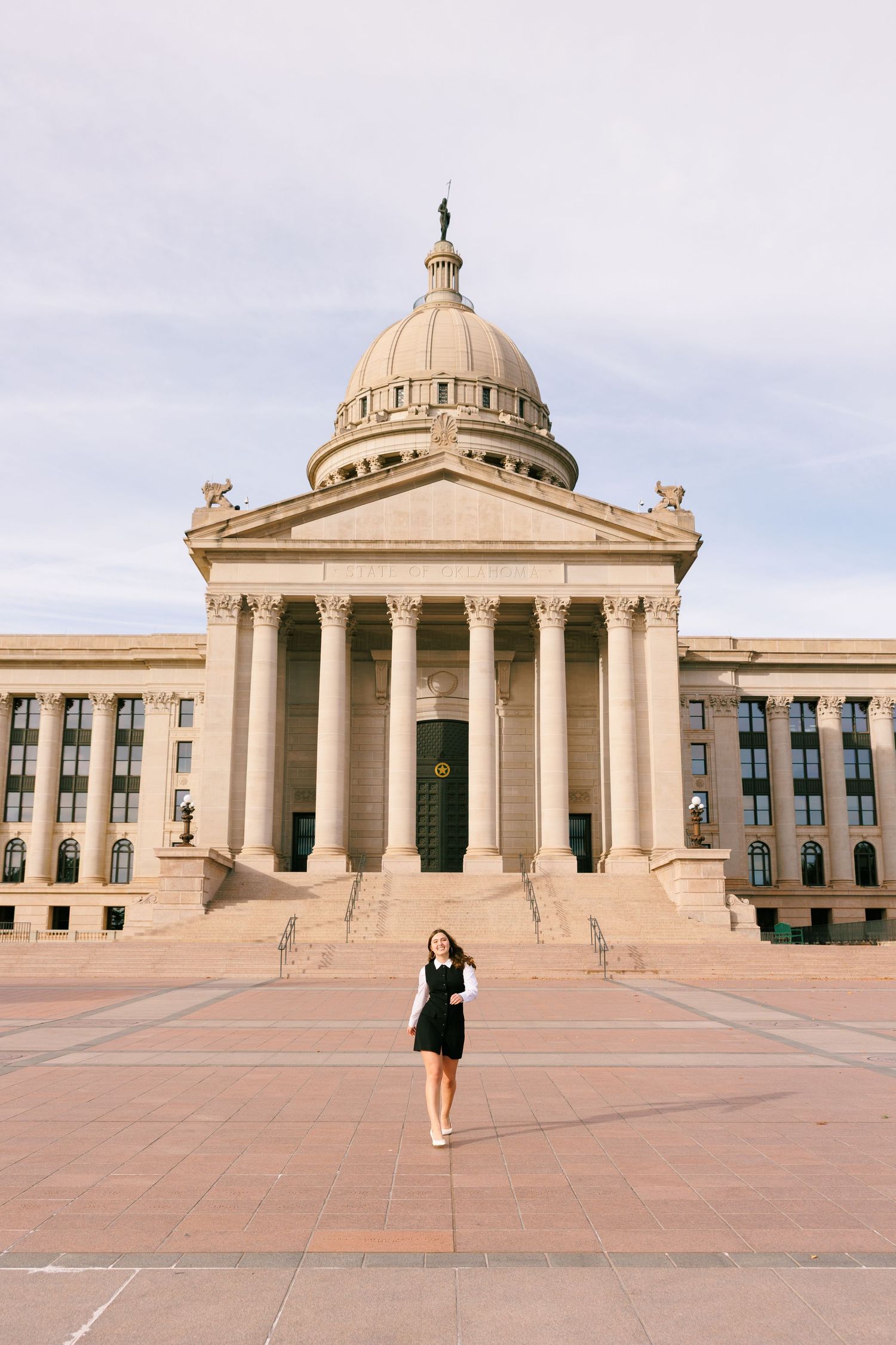 Architectural shots of a grand government building with classical columns and domed roof.