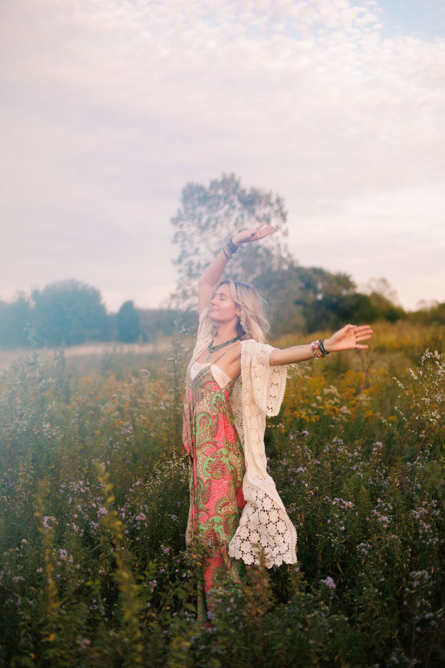 Whimsical poses captured in a misty flower field during a lifestyle photoshoot.