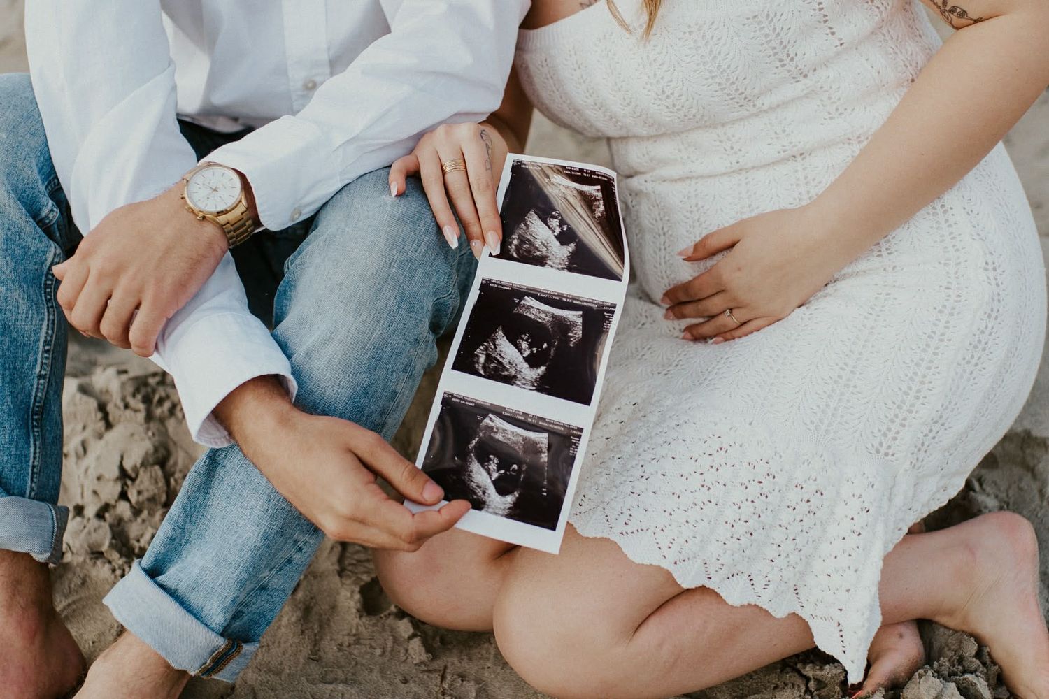 expecting couple celebrating their pregnancy announcement photos.