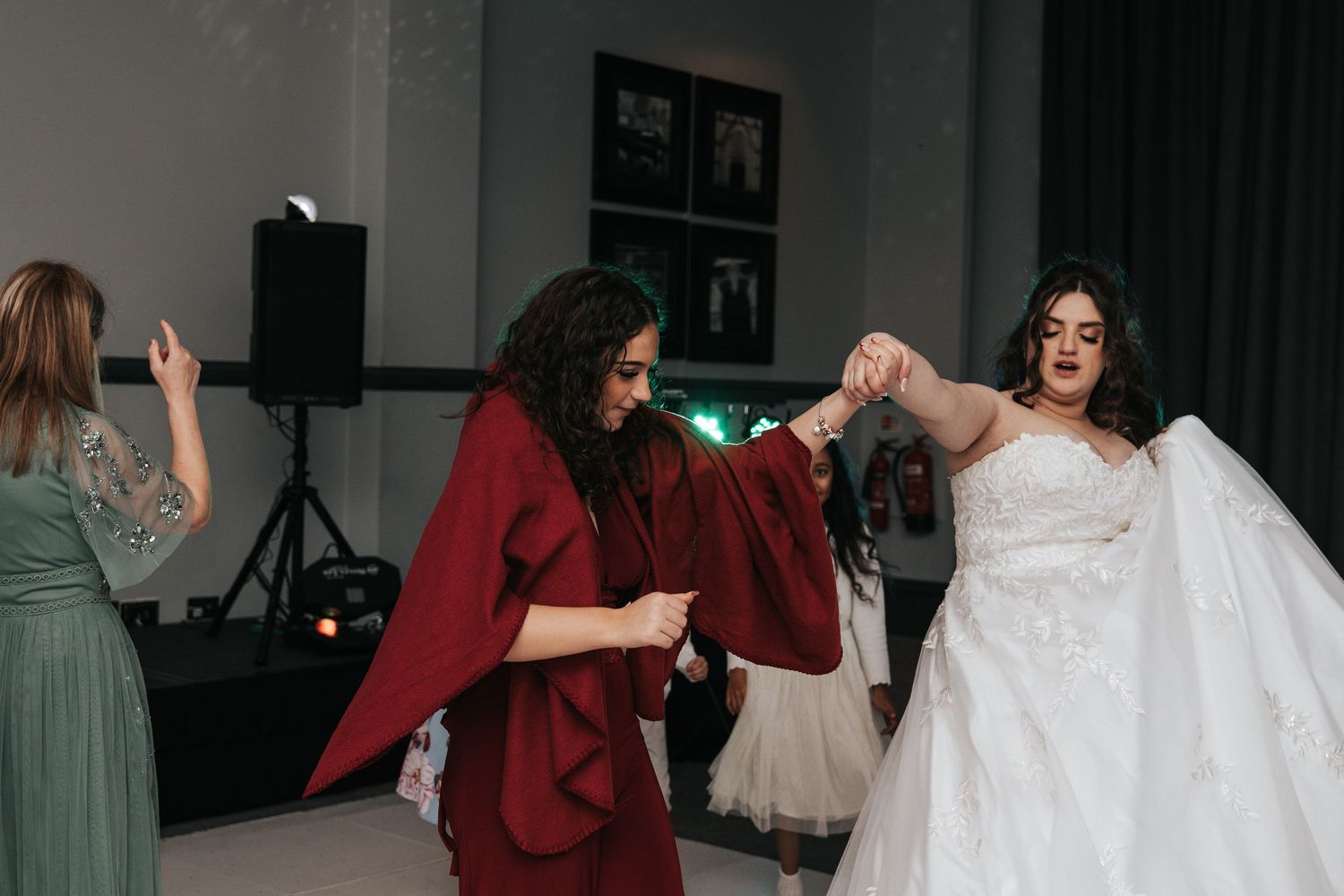 A sequence of black and white photos showing couples dancing together in an indoor setting.
