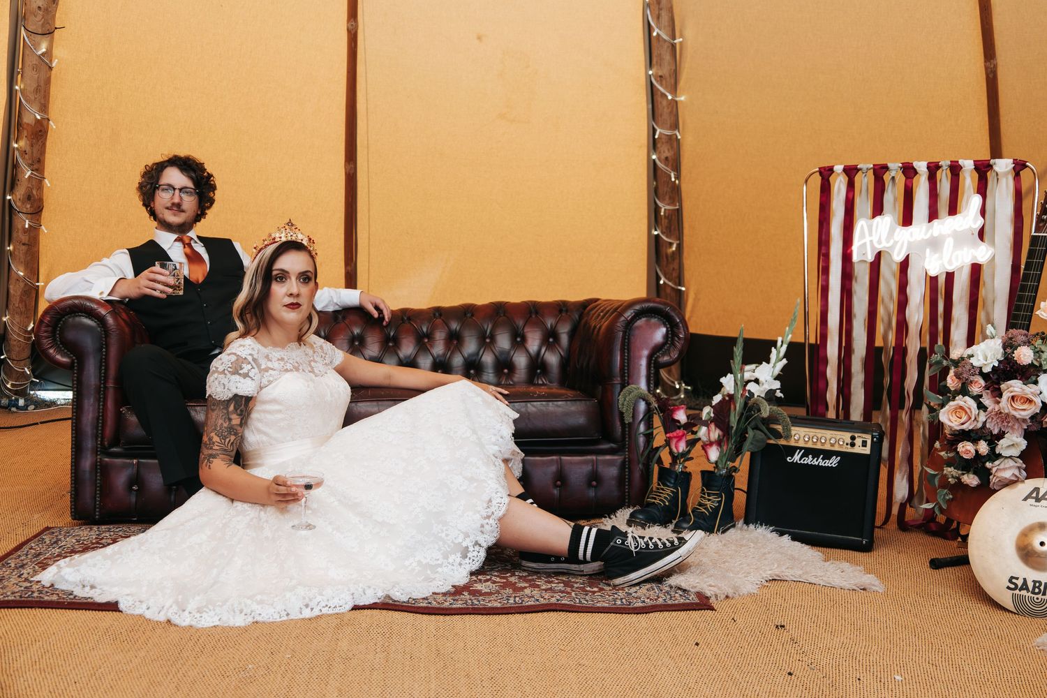 Wedding venue interior with leather seating and romantic lighting creating an intimate atmosphere.