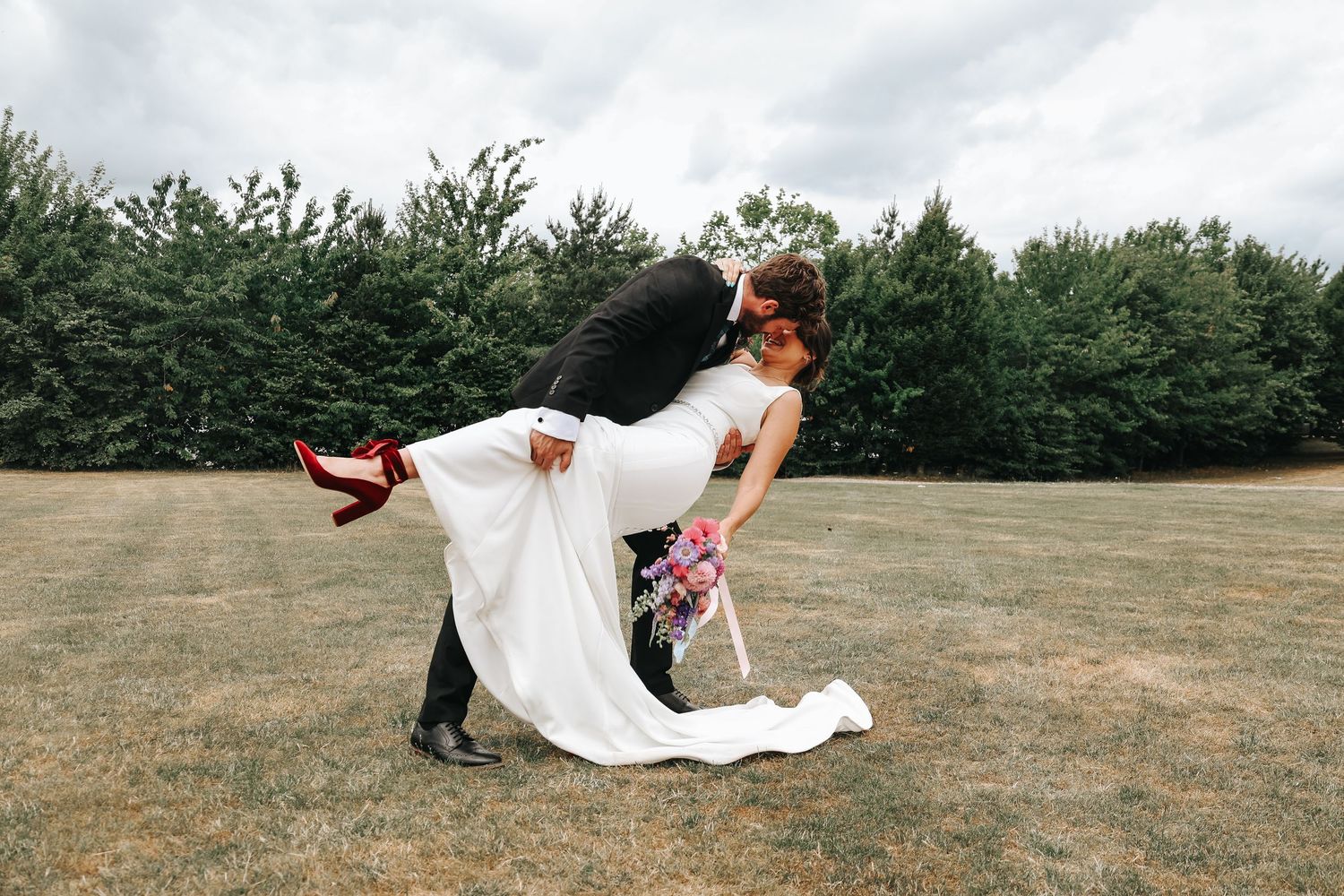 A series of romantic wedding photos showing a dramatic dip in an outdoor setting.