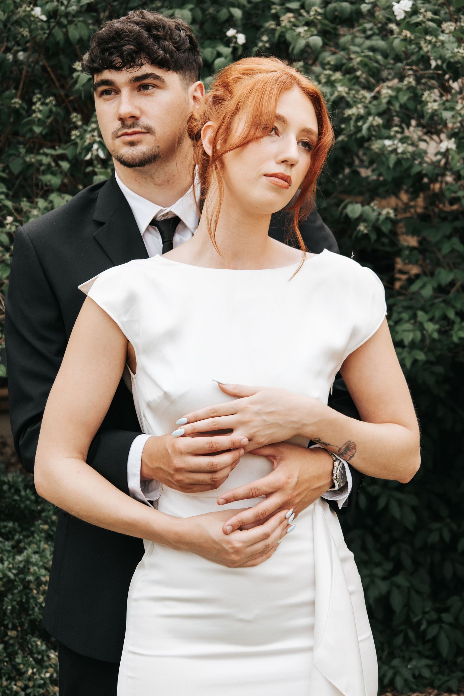 Intimate wedding portrait showing tender embrace between newlyweds.