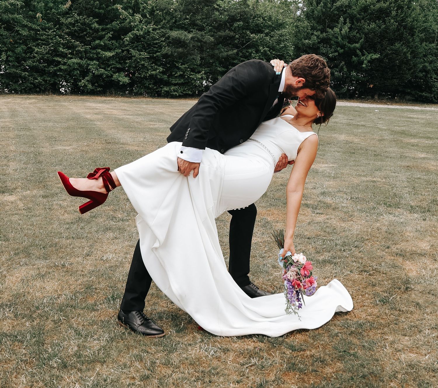 A series of playful wedding photos showing a dramatic dip on an outdoor field.