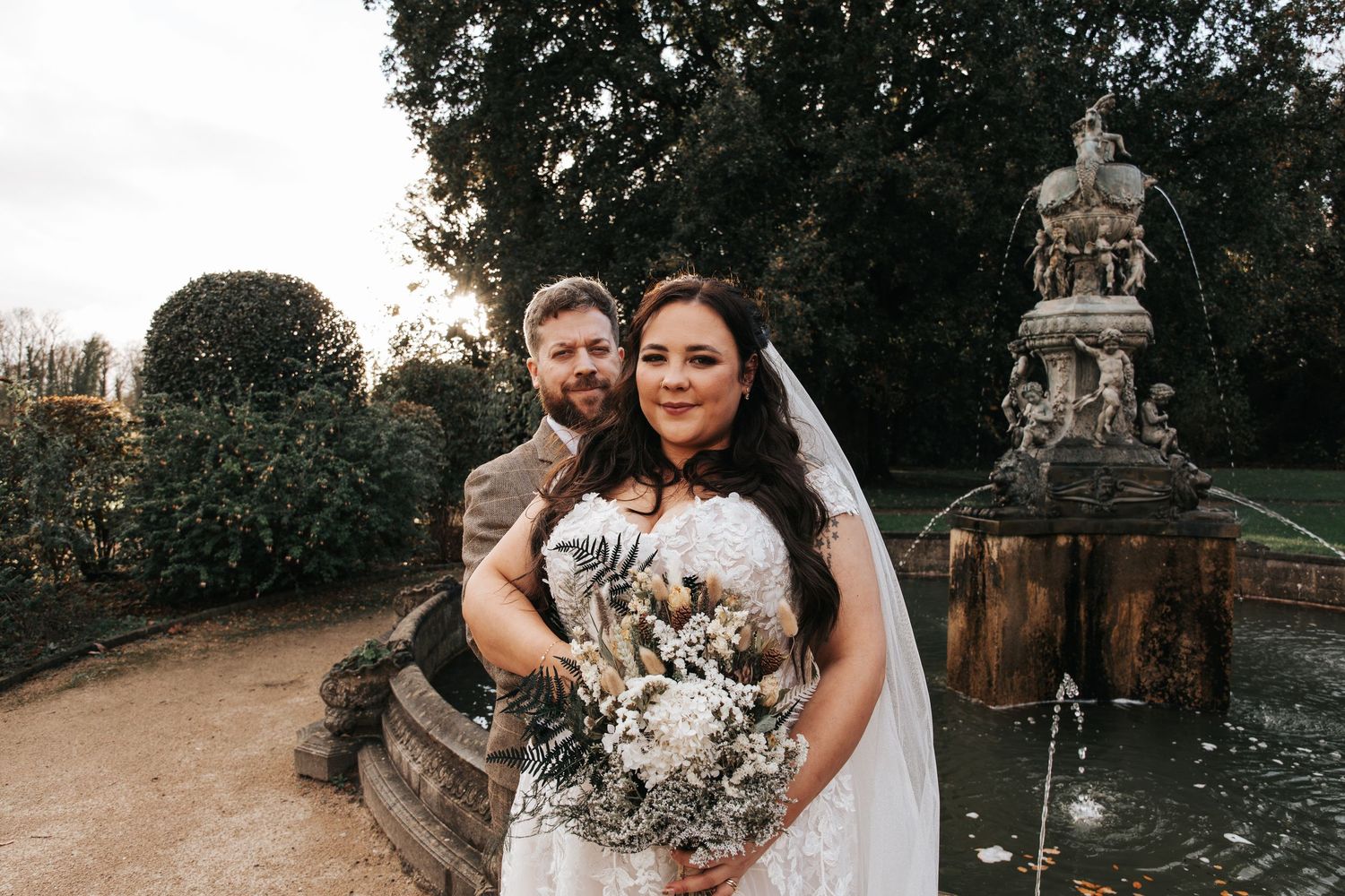 Outdoor wedding portraits captured in natural autumn lighting.