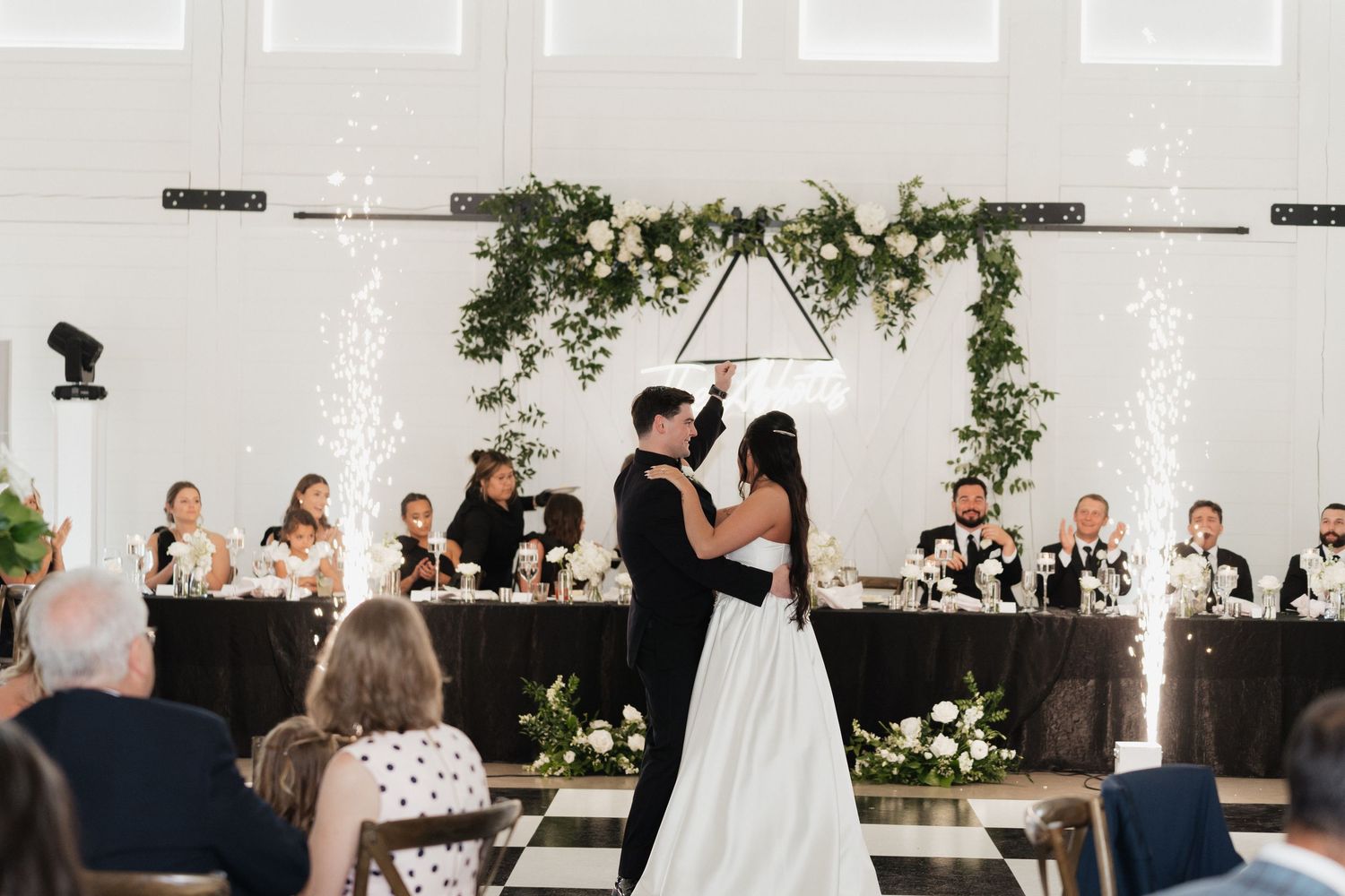 Wedding photographer in Delphi, Indiana capturing bride and groom during wedding reception atSixpence in Whitestown, IN