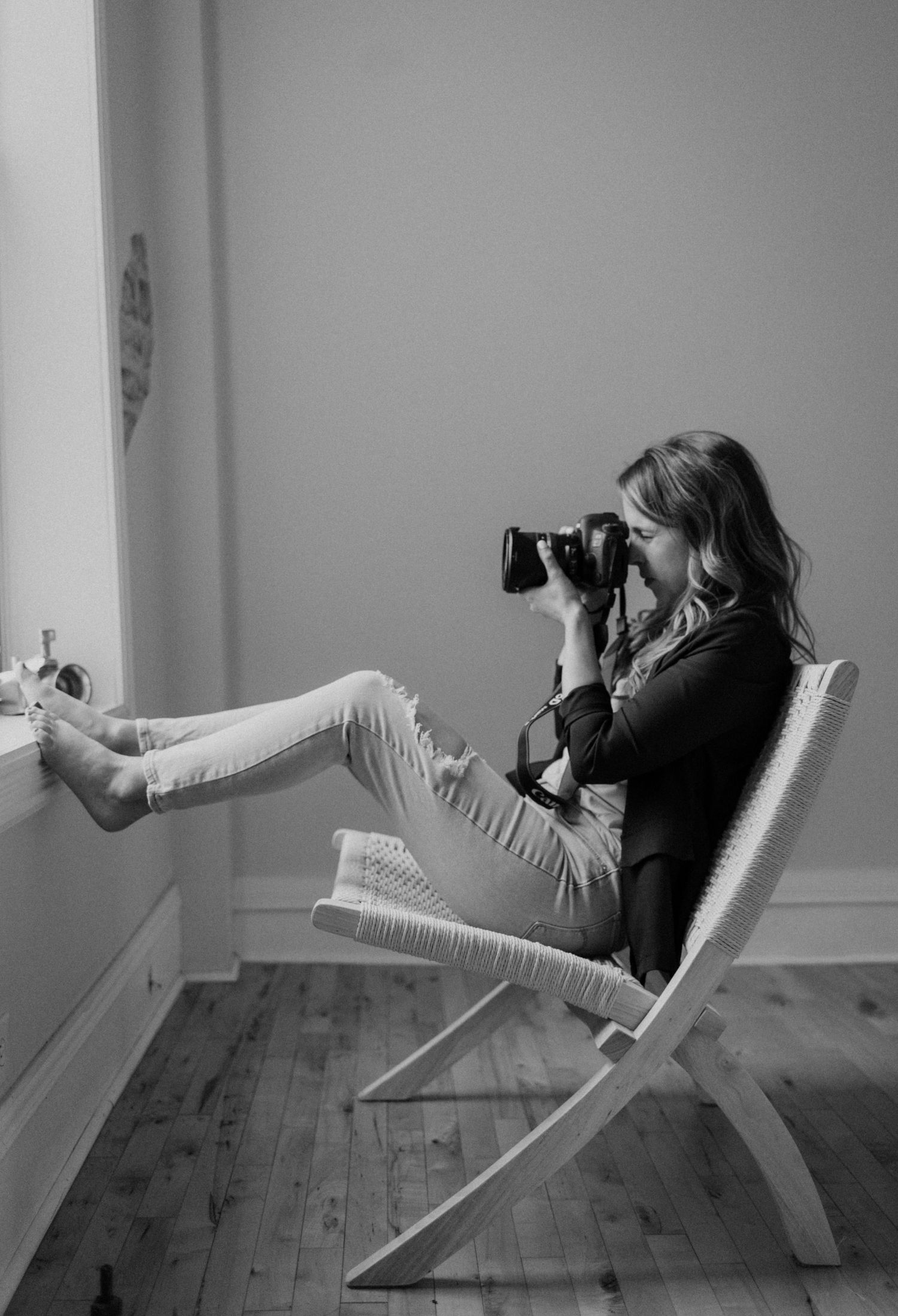 Creative sequence of a photographer lying on a white chair while taking photos.