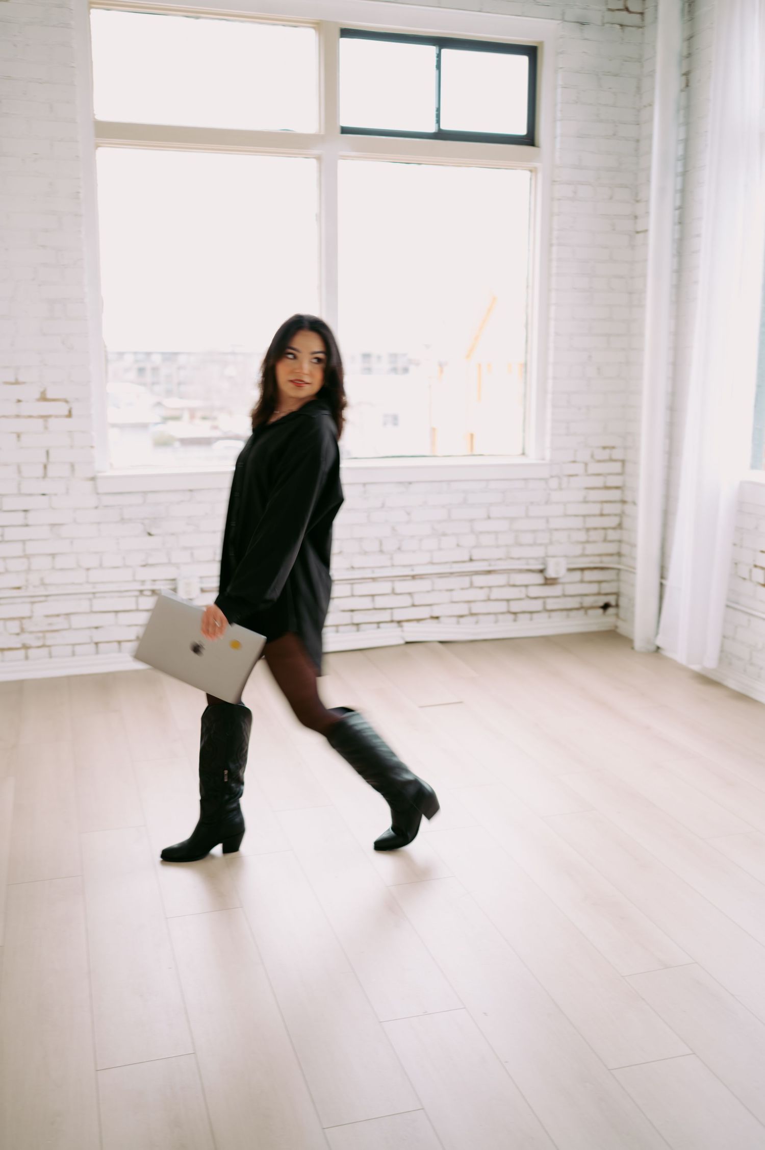 Creative movement portraits in minimalist white studio setting.