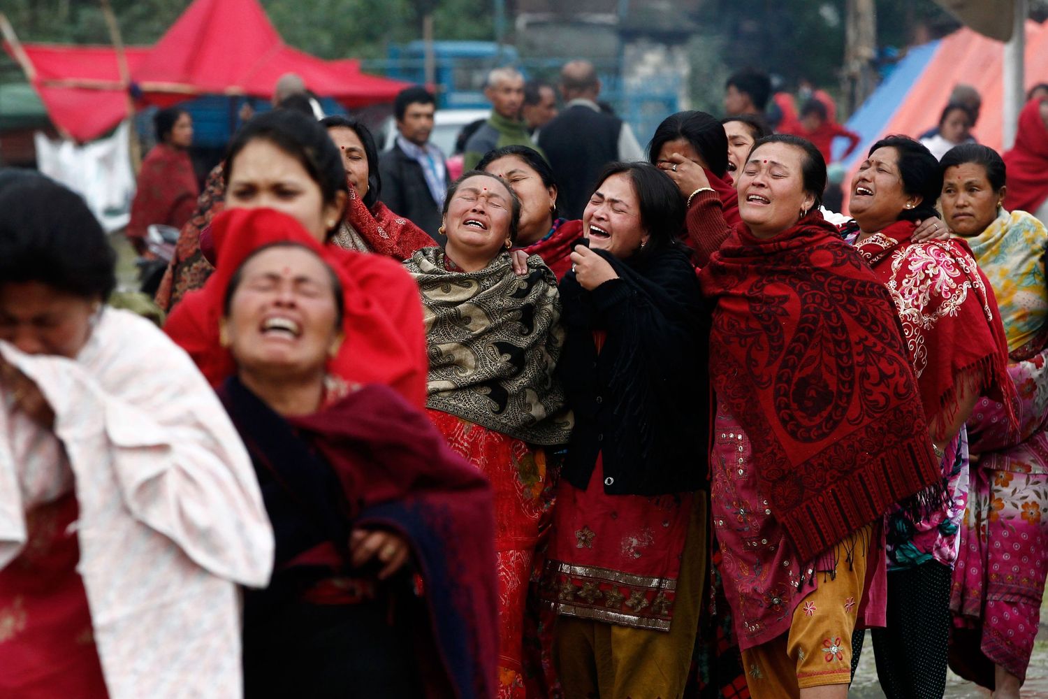 Women mourning the loss of loved ones after the Nepal earthquake — emotional and powerful humanitarian photojournalism.