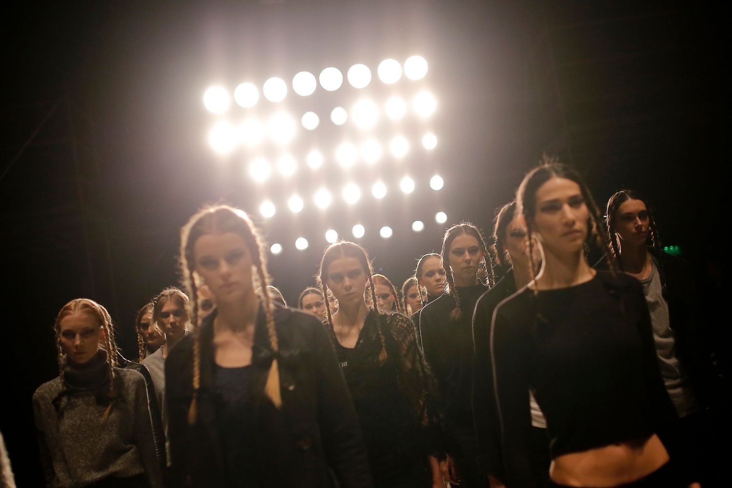 Fashion model walking the runway during NYC Fashion Week — captured mid-stride with confidence and style.