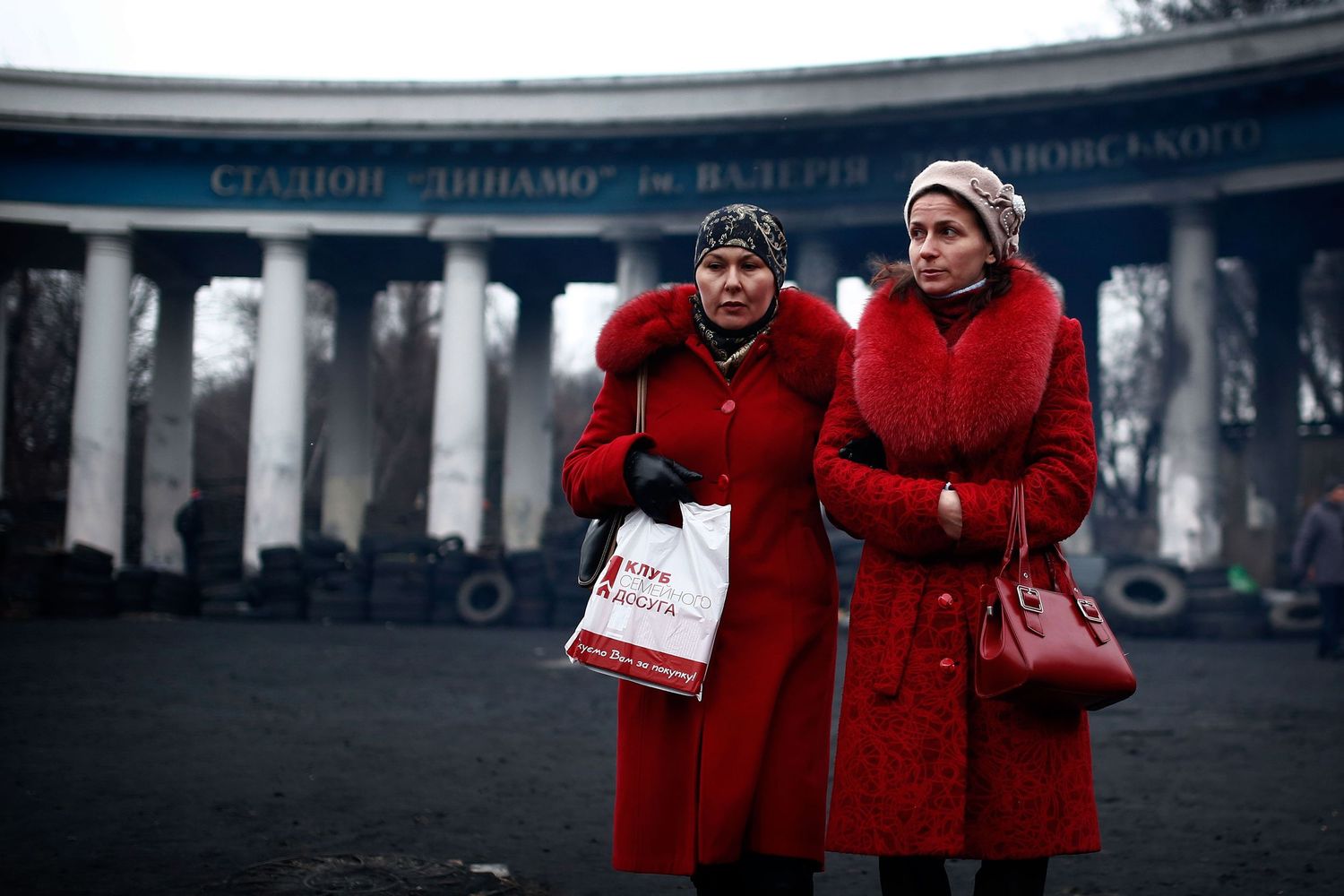 Two women walking through Independence Square in Kyiv — documentary-style street photo capturing everyday life after the Maidan protests.