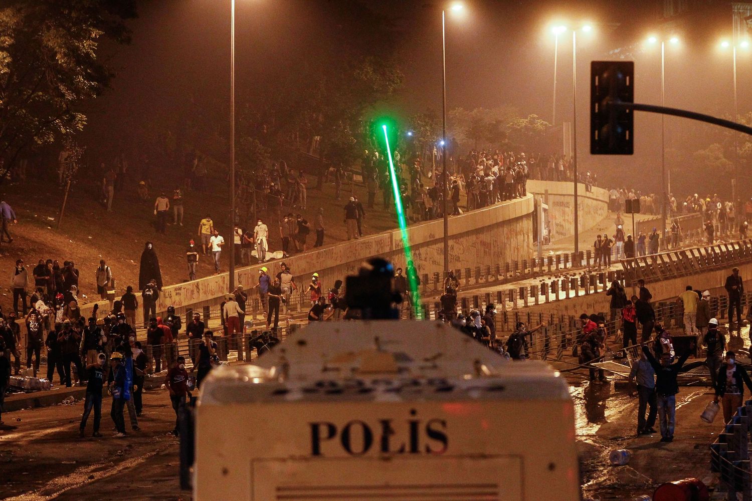Protesters confronting police during the Gezi Park demonstrations in Istanbul — documentary photo capturing civil resistance.