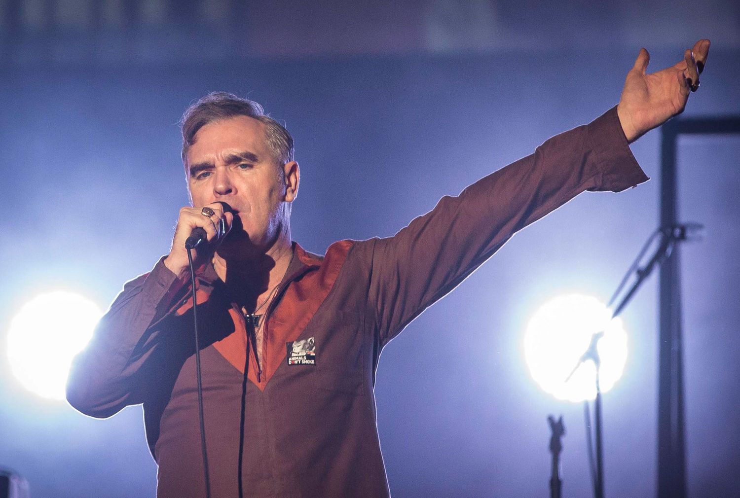 Morrissey performing live on stage in New York City — emotional concert photography capturing indie rock legend in action.