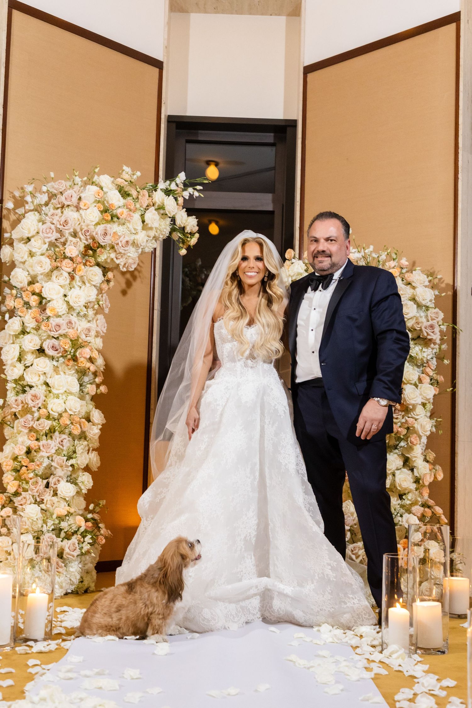 Luxury wedding photography in NYC, featuring a professional portrait of a bride and groom in a romantic floral setting.