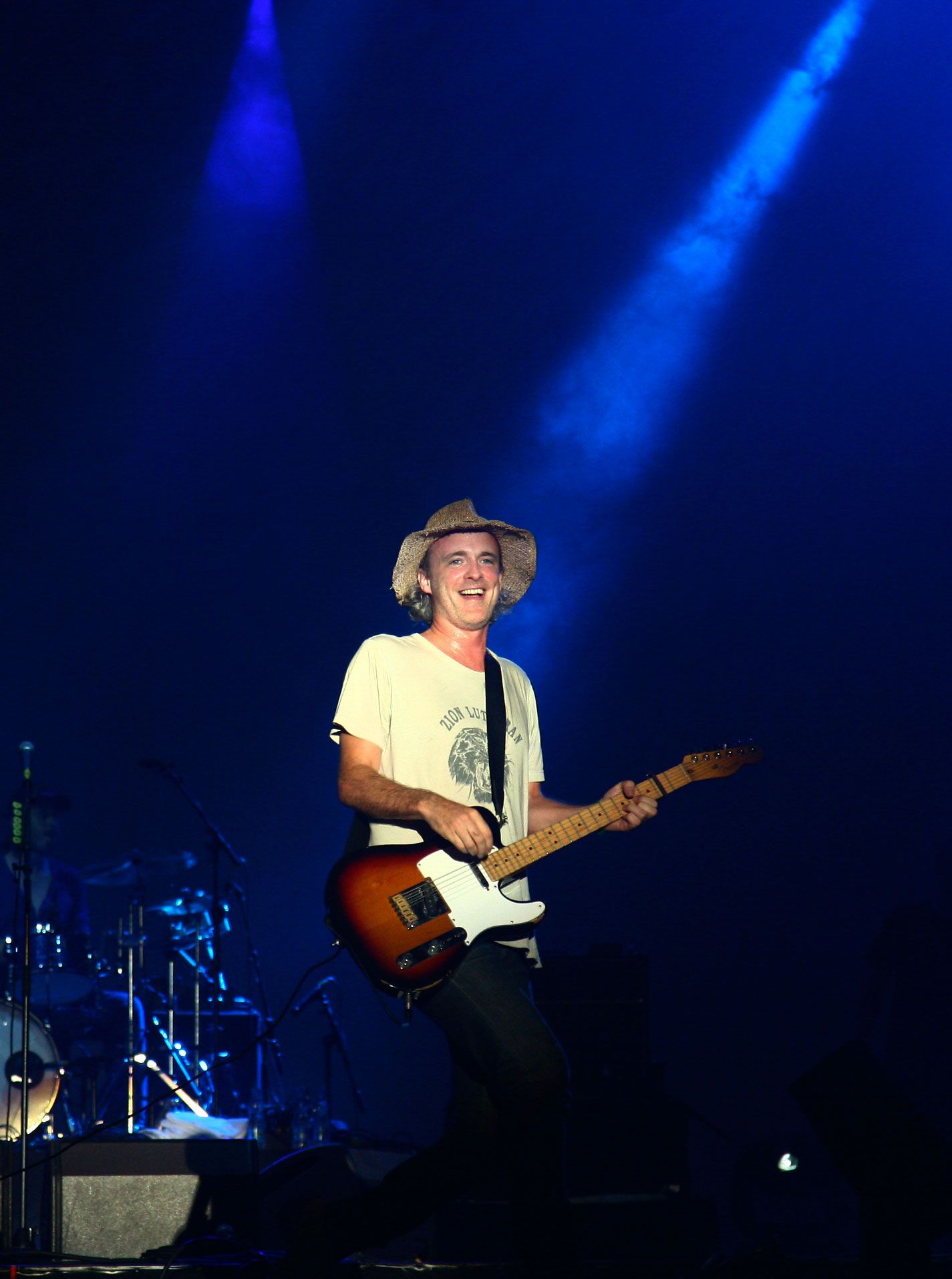 Live photo of Travis on stage in NYC — indie rock legends performing with intimacy and melodic depth.