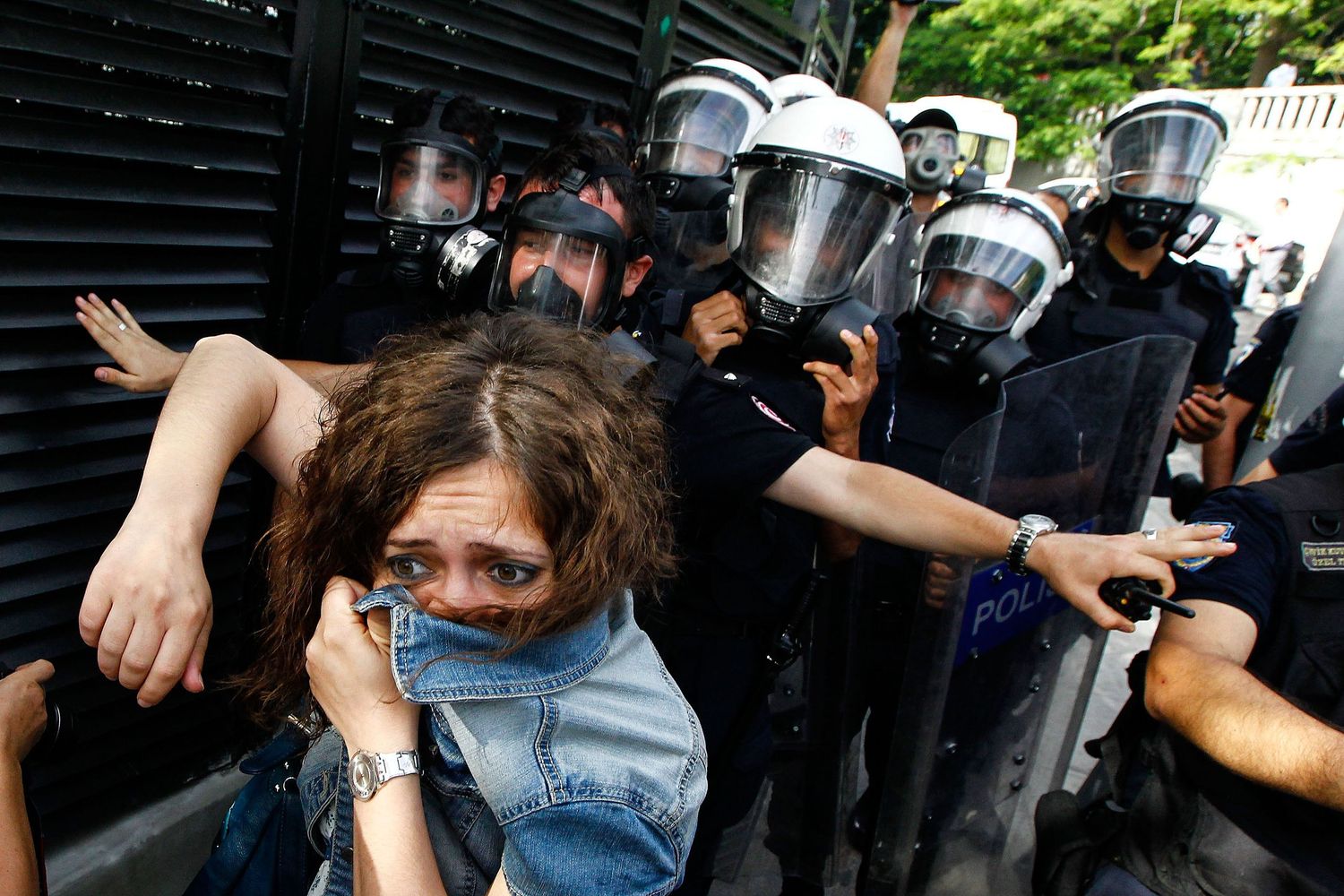 Protesters confronting police during the Gezi Park demonstrations in Istanbul — documentary photo capturing civil resistance.