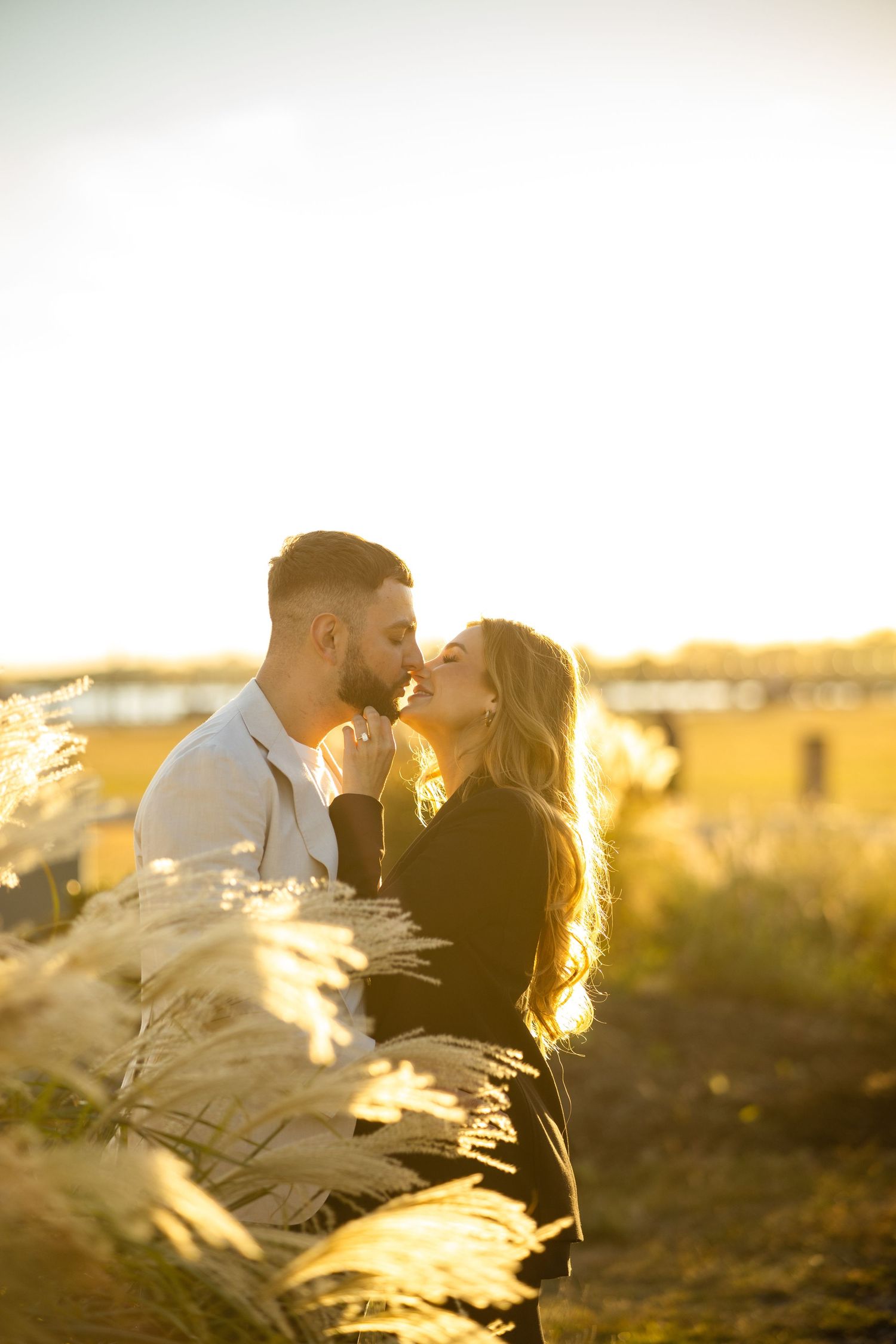 Golden hour engagement photography at Liberty State Park, featuring a romantic couple portrait with natural sunset lighting in Jersey City.