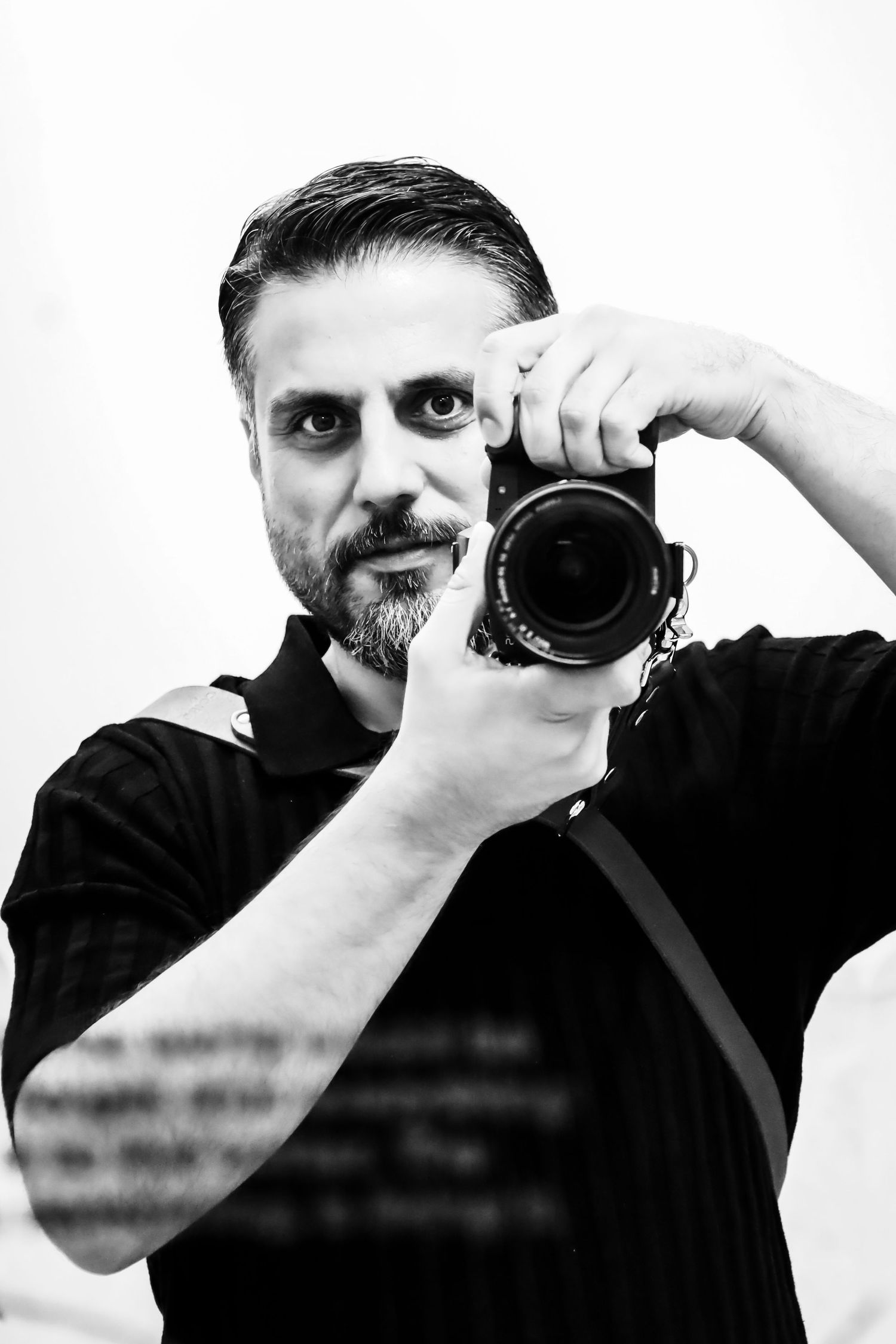 NYC Photographer Ben Bulent Doruk taking his picture from the mirror.