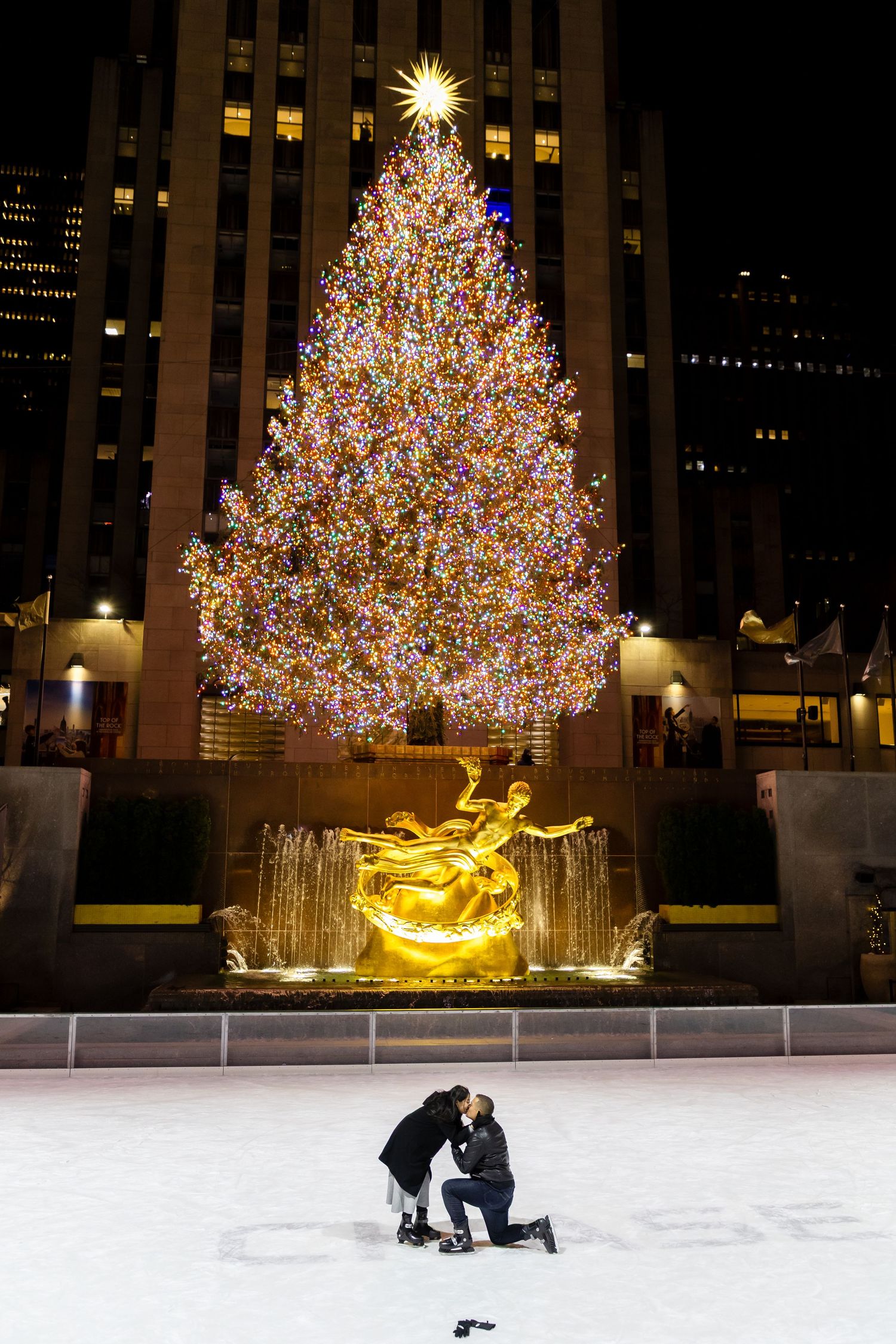 Romantic surprise proposal at Bow Bridge, Central Park – Professional NYC engagement photographer capturing iconic New York City moments.