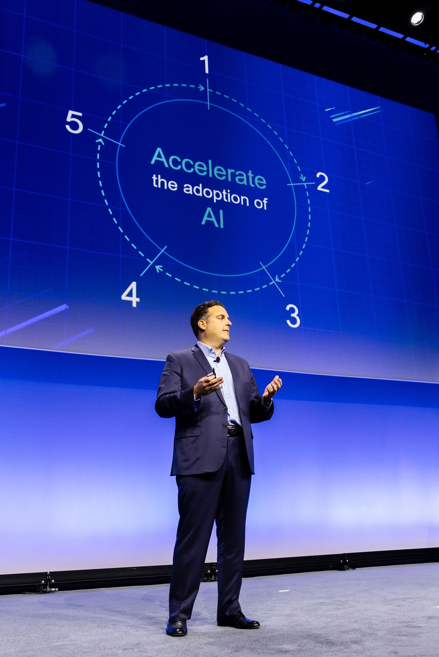 Corporate event photography of a speaker presenting at an AI-focused tech conference in New York City.