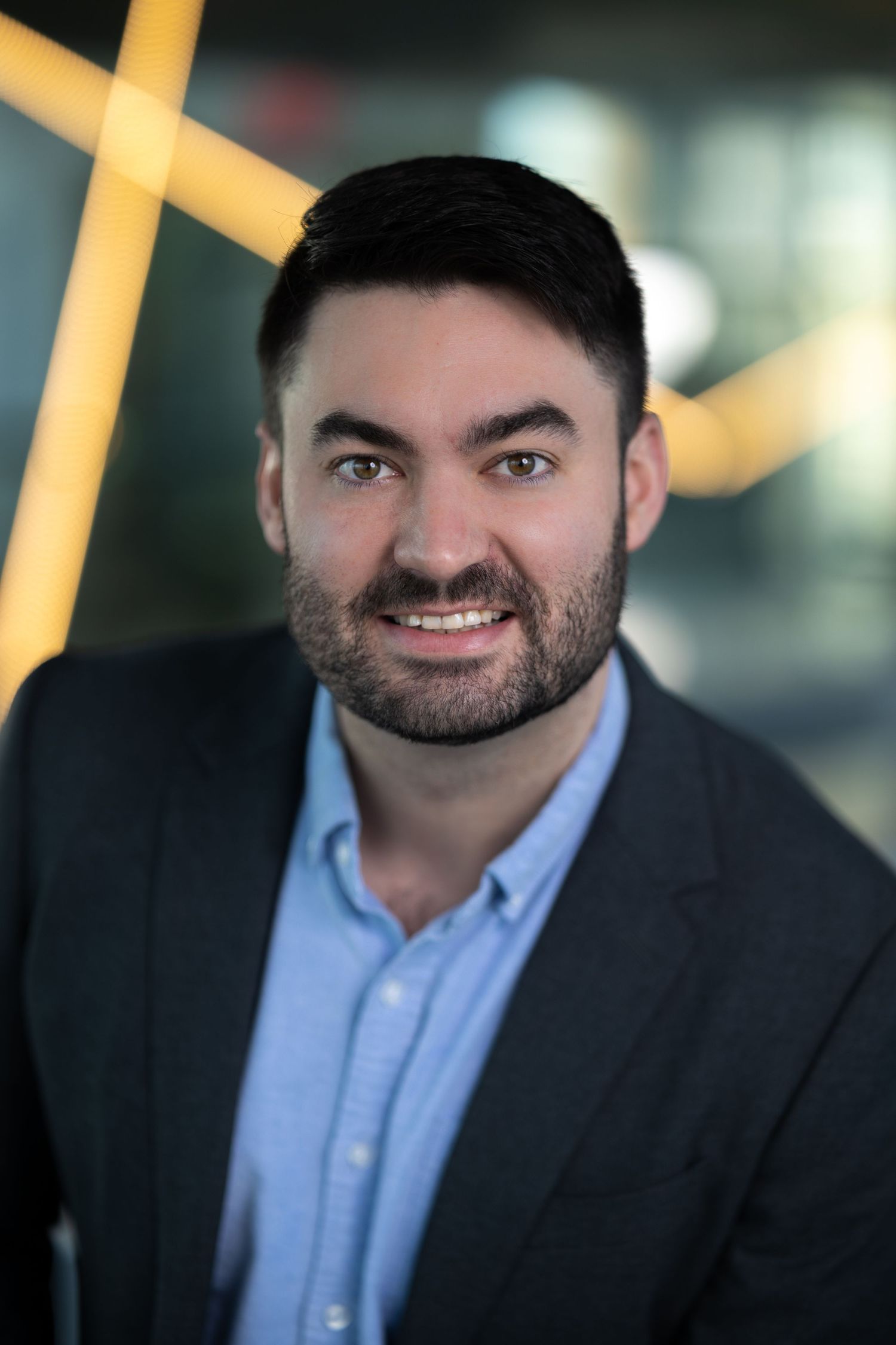 Business professional posing for a clean, natural headshot session – NYC & Jersey City.