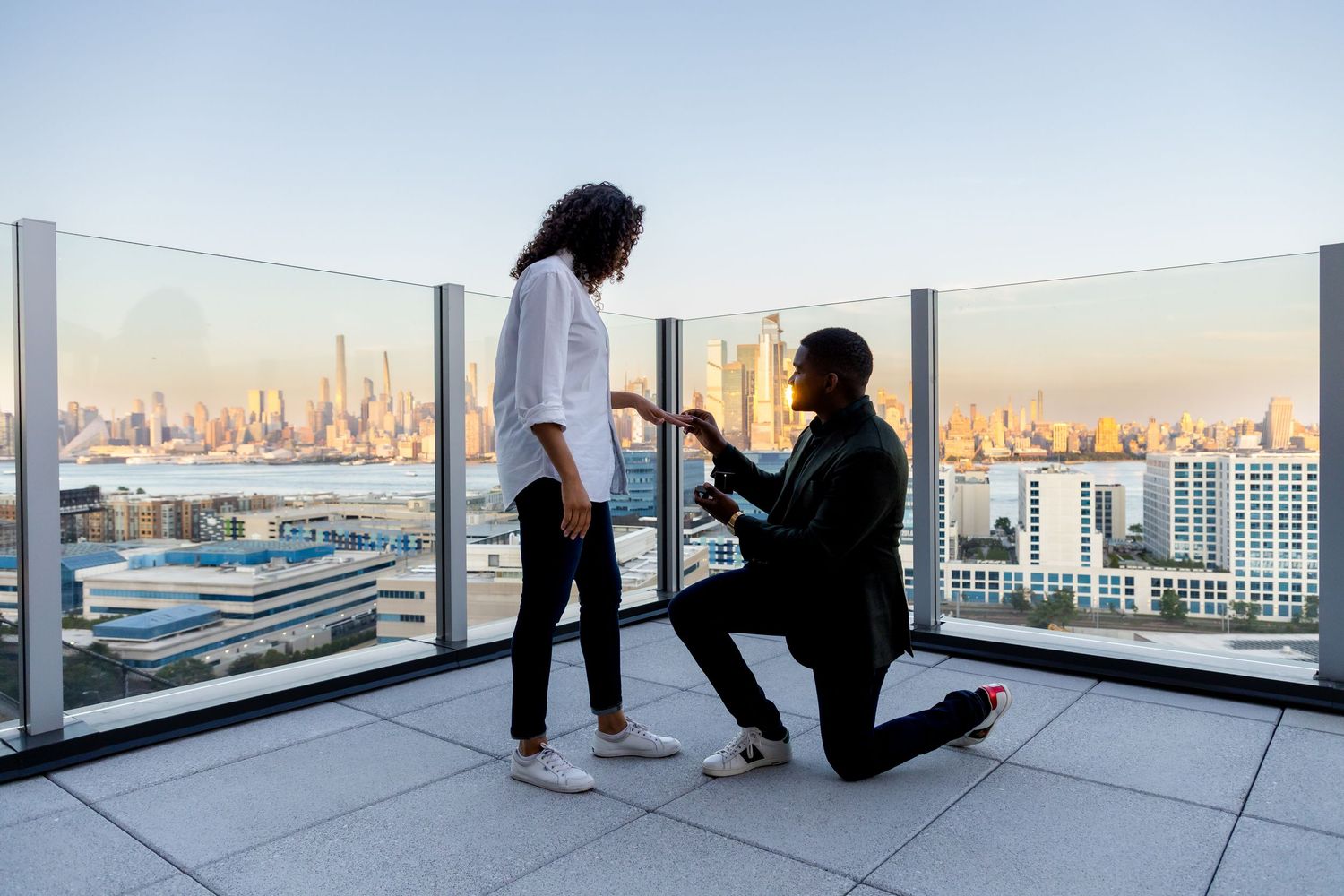 Surprise engagement session at Rockefeller Center, NYC – Professional photographer for iconic New York City proposals.