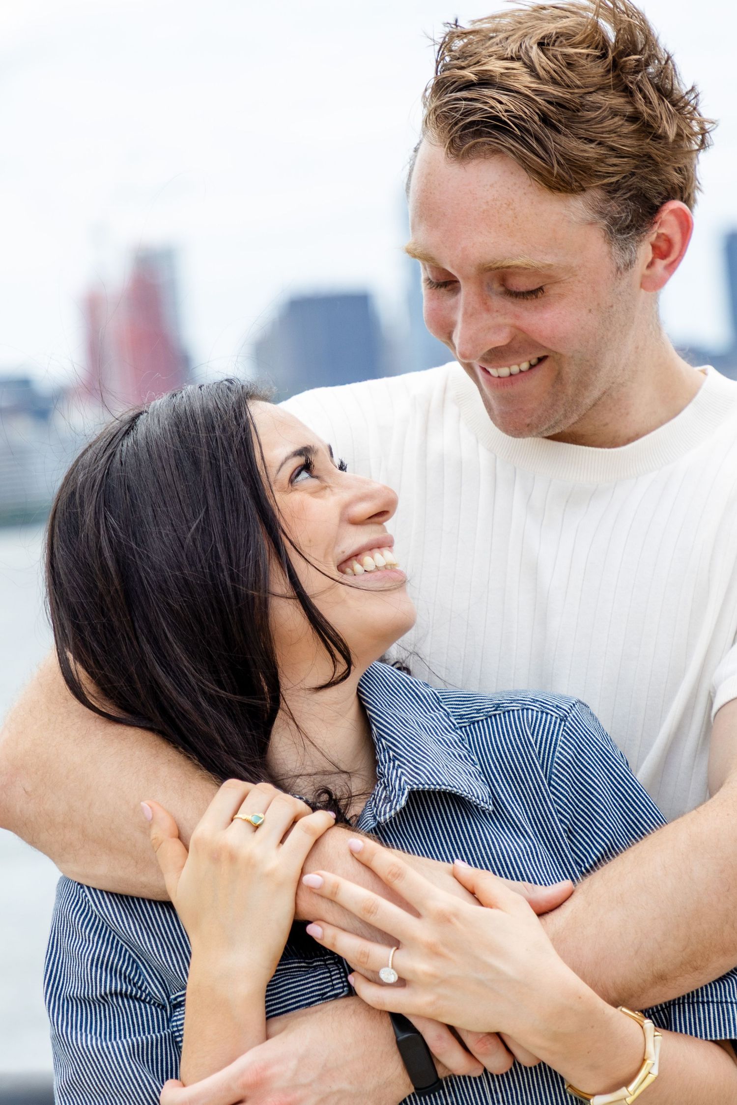 A surprise marriage proposal in Hoboken captured by a local proposal photographer with the Manhattan skyline backdrop.