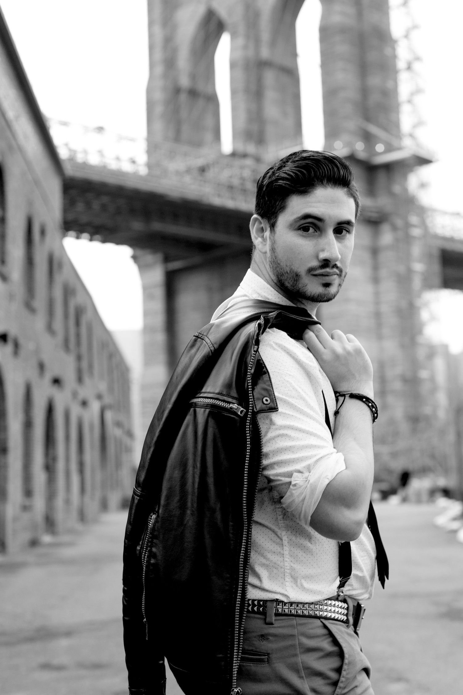 Creative album cover photo of an emerging artist in Brooklyn Dumbo— expressive and urban portrait.