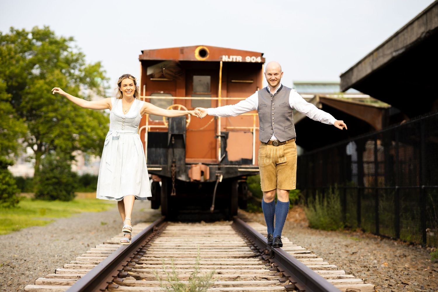 Cinematic engagement portrait captured at Liberty State Park train concourse in Jersey City, NJ.