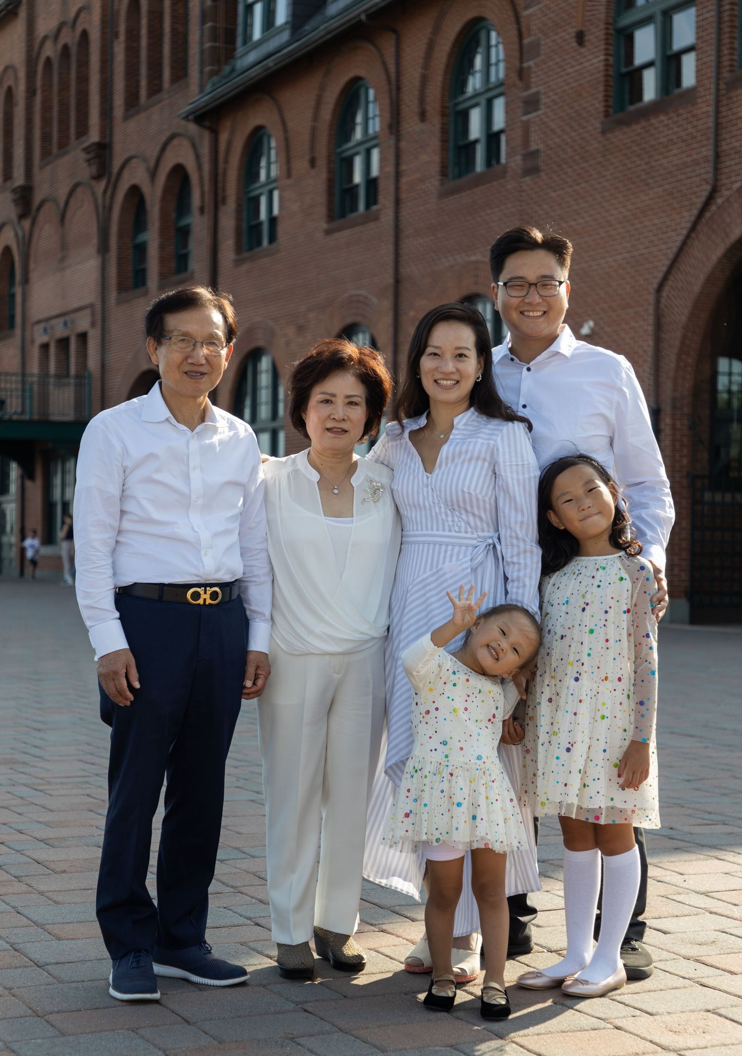 Family portraits taken at Liberty State Park, featuring a blend of nature and NYC skyline as a backdrop.