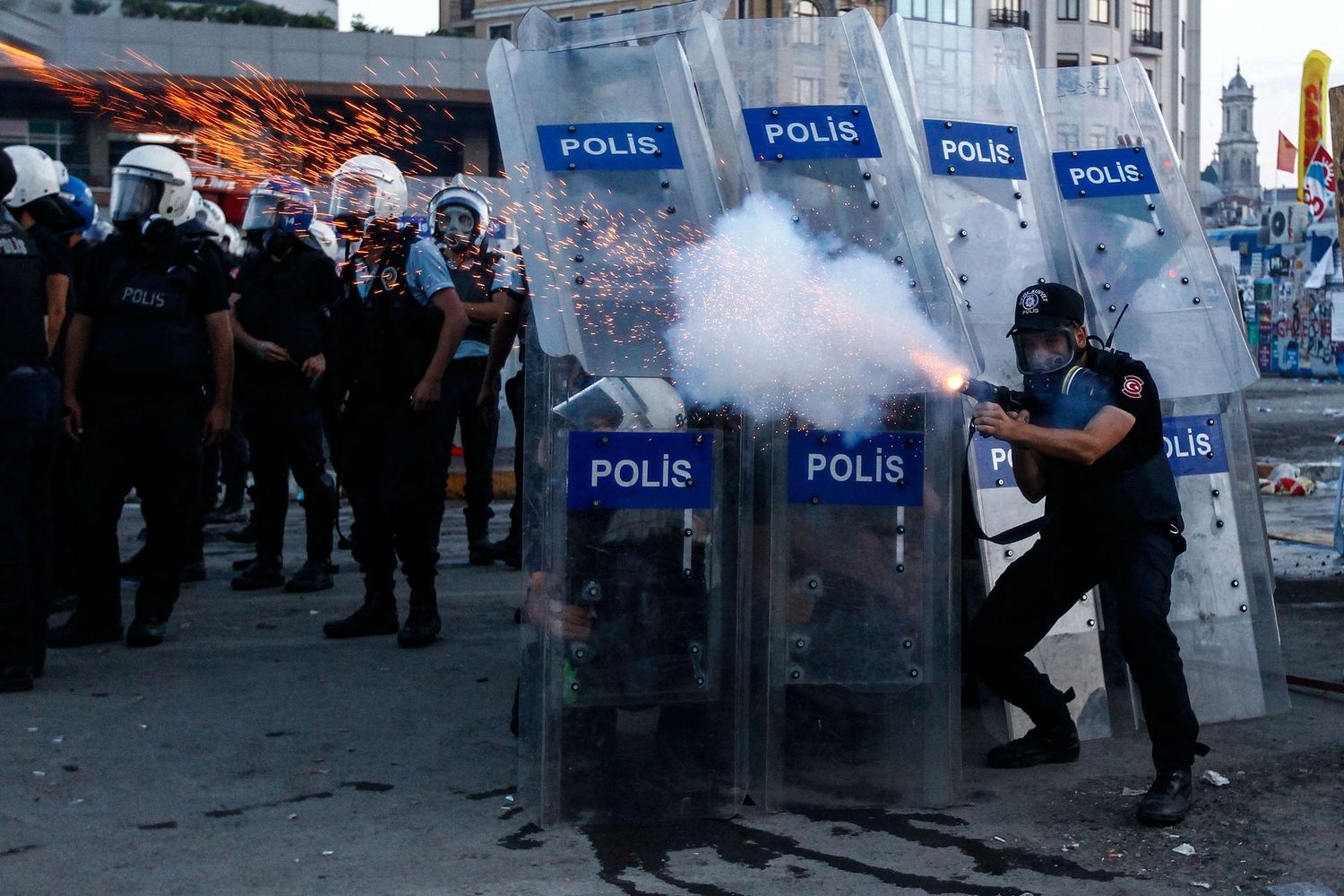 Protesters confronting police during the Gezi Park demonstrations in Istanbul — documentary photo capturing civil resistance.