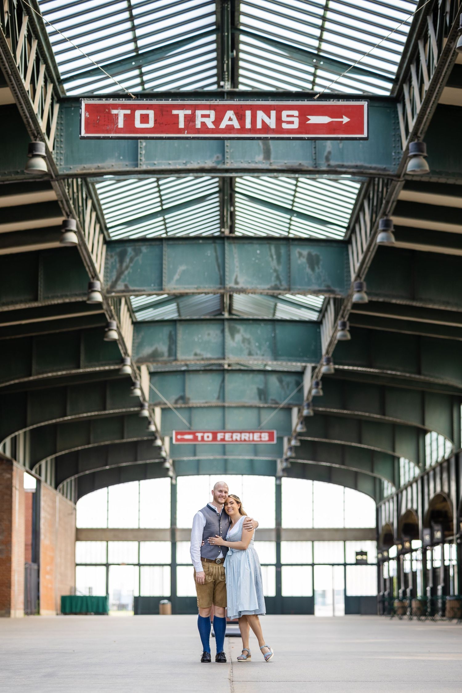 Cinematic engagement portrait captured at Liberty State Park train concourse in Jersey City, NJ.