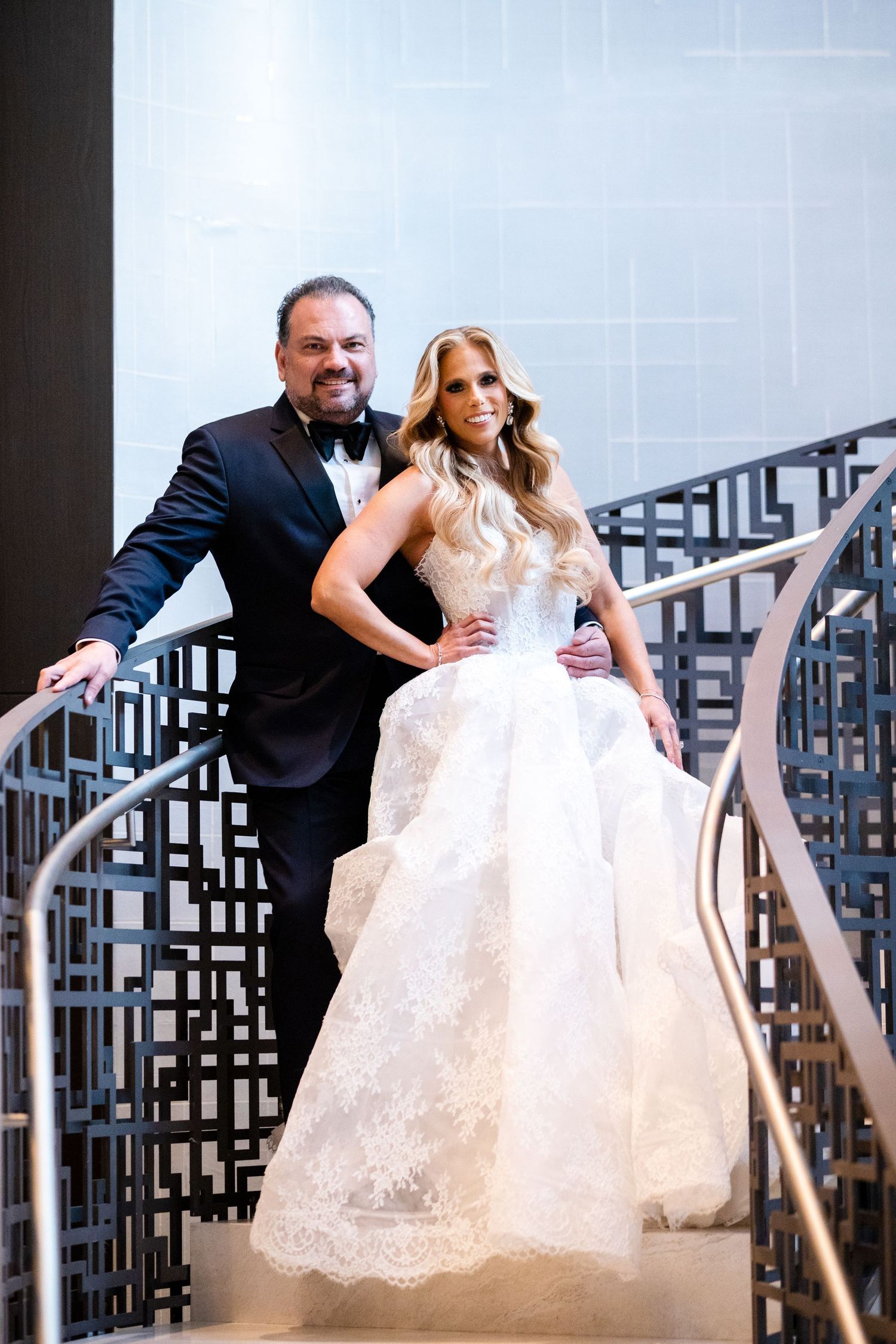 Luxury wedding photography in NYC, featuring a professional portrait of a bride and groom in a romantic floral set