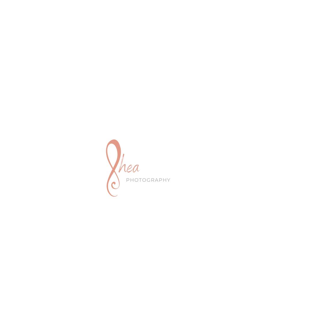 Simple and elegant coral-colored photography business logo design on white background.