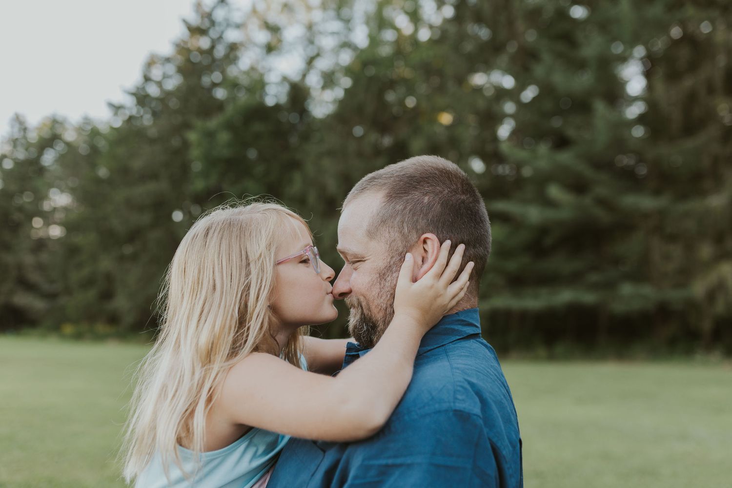 Intimate couple sharing tender moments in a serene outdoor setting.