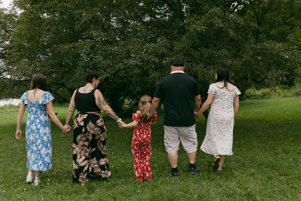 A series of candid moments showing people walking and playing in a grassy field.