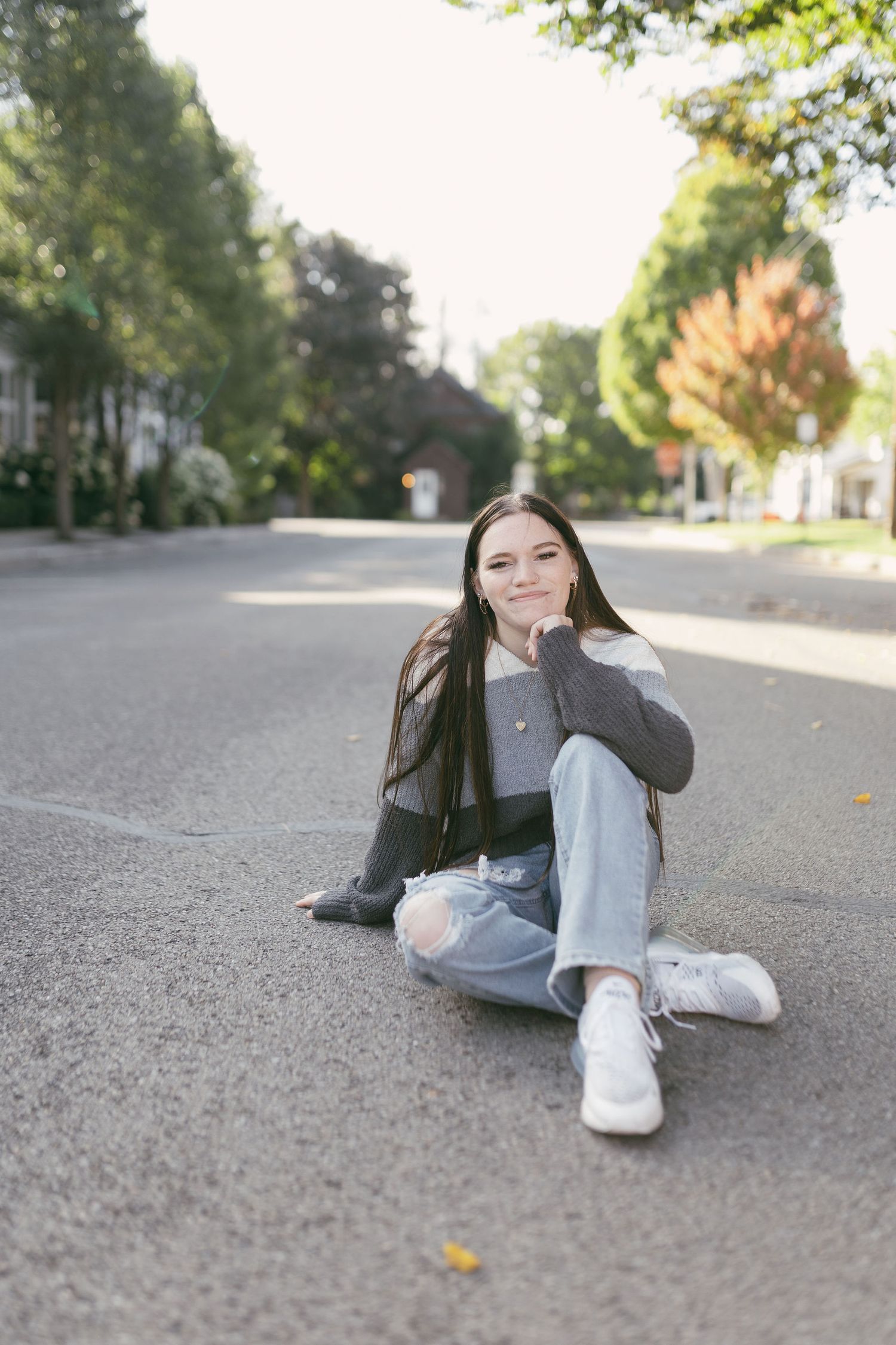 Casual poses on pavement showing relaxed street style photography.