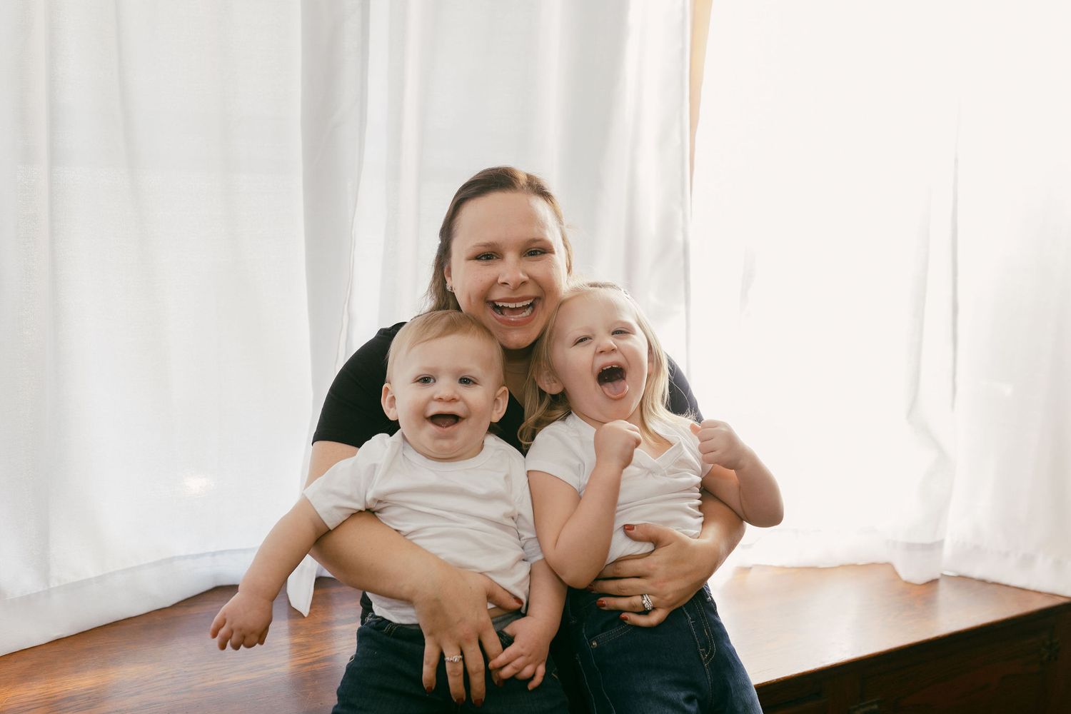 Family group sharing joyful moments together on white background.