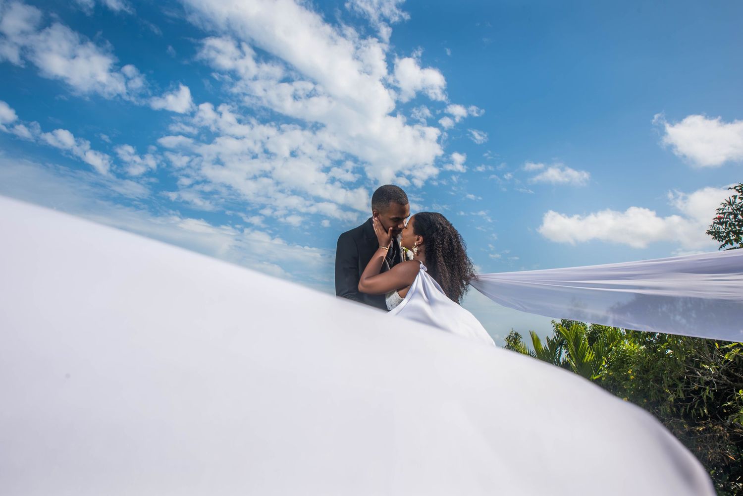 Destination Wedding in Jamaica showing bride and groom having an intimate moment celebrating their nuptials