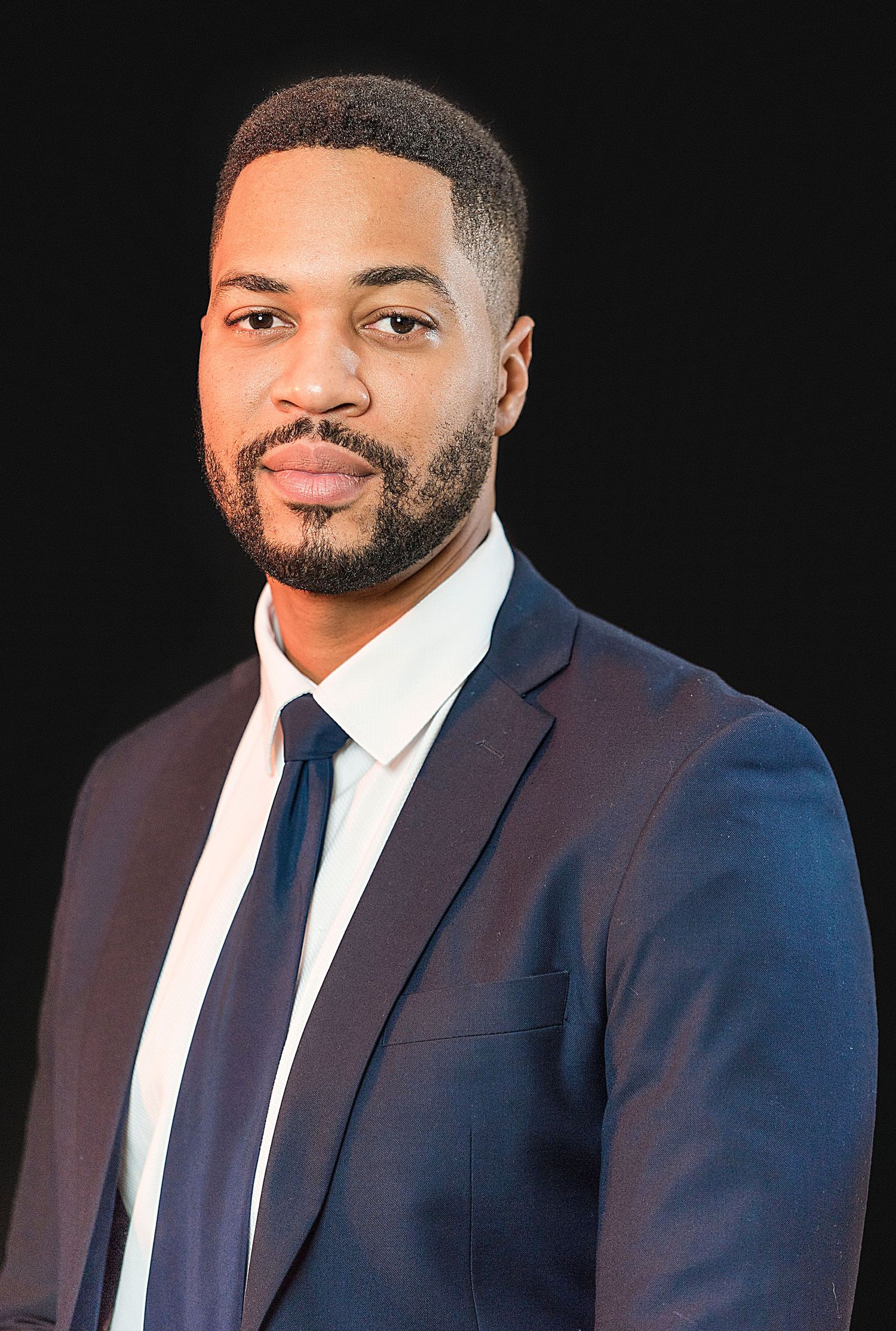 Commercial Portrait Photographer in Jamaica shooting headshot of a corporate professional