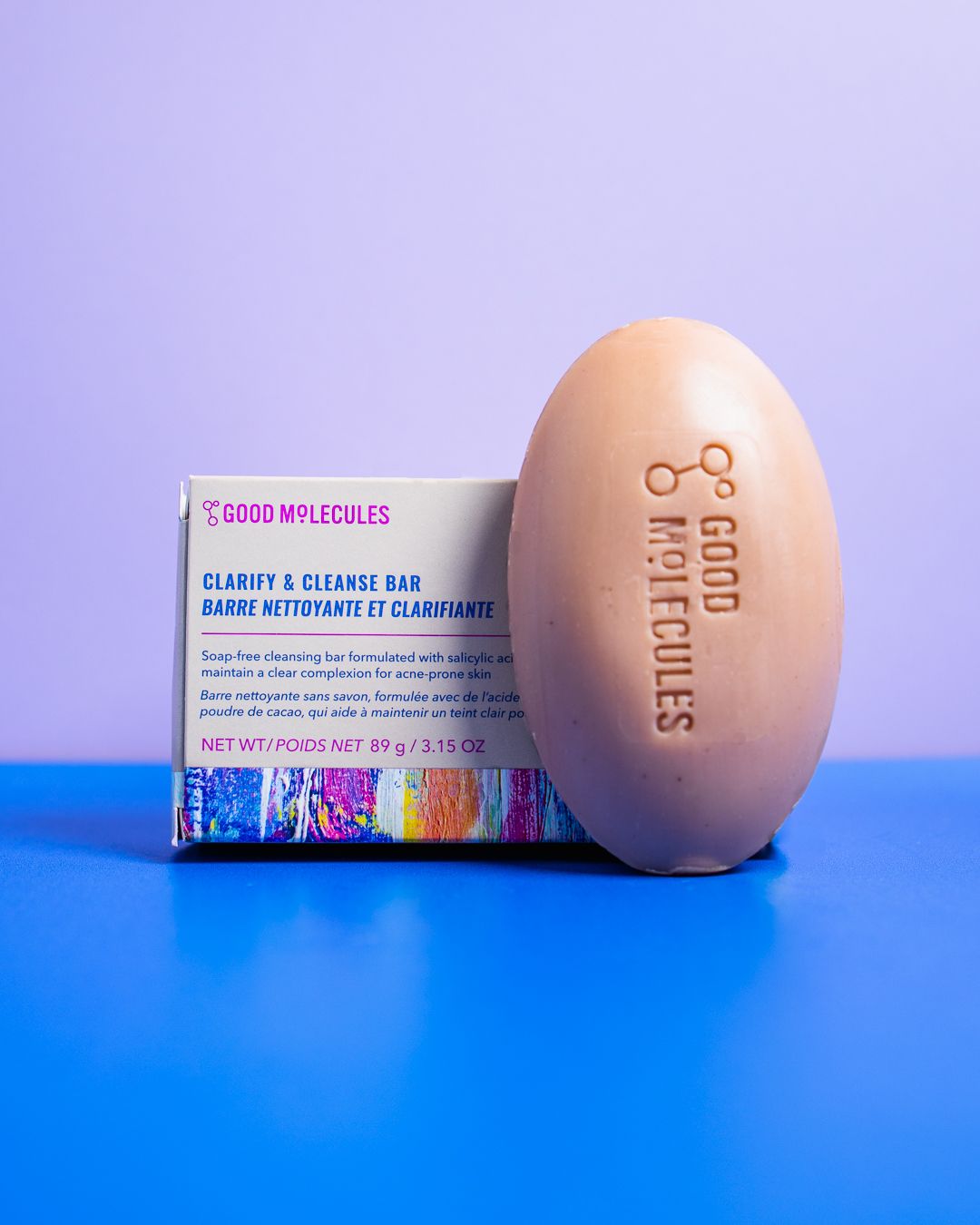 A series of four minimalist photos showing a light pink egg-shaped object against a vibrant blue background with product packaging.
