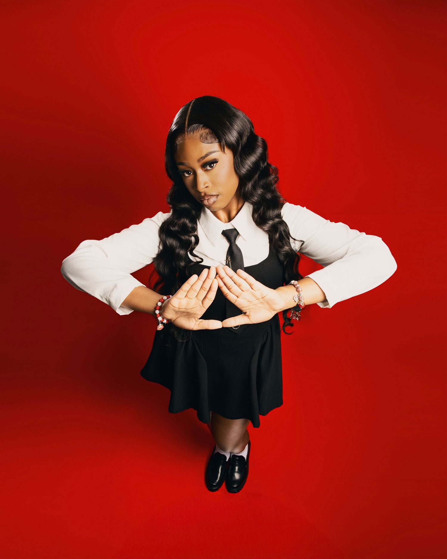 Graduation photo session in-studio with creative posing and bold colors by Rashad Gilmore