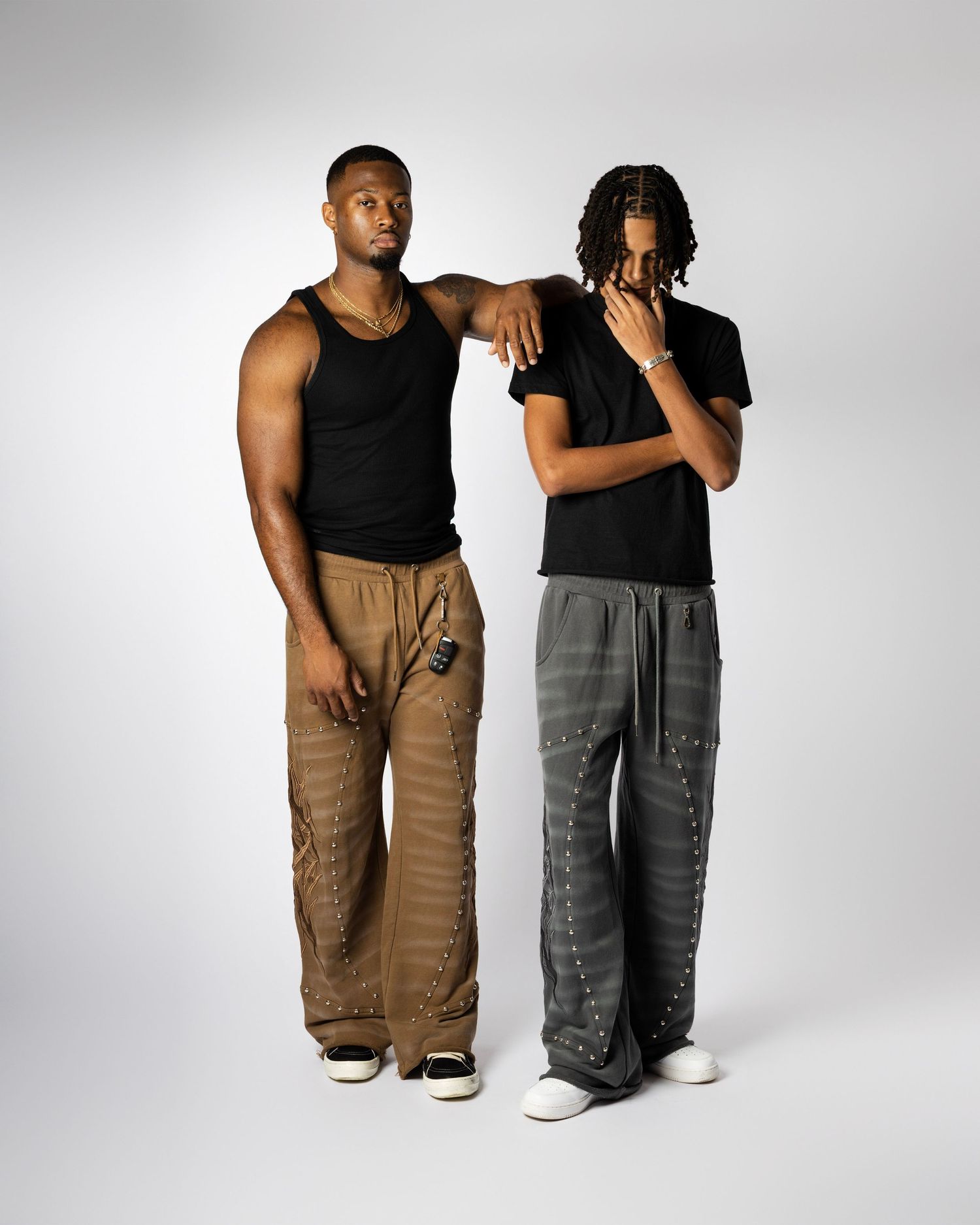 Commercial photography of fashion brand apparel with models posing in studio