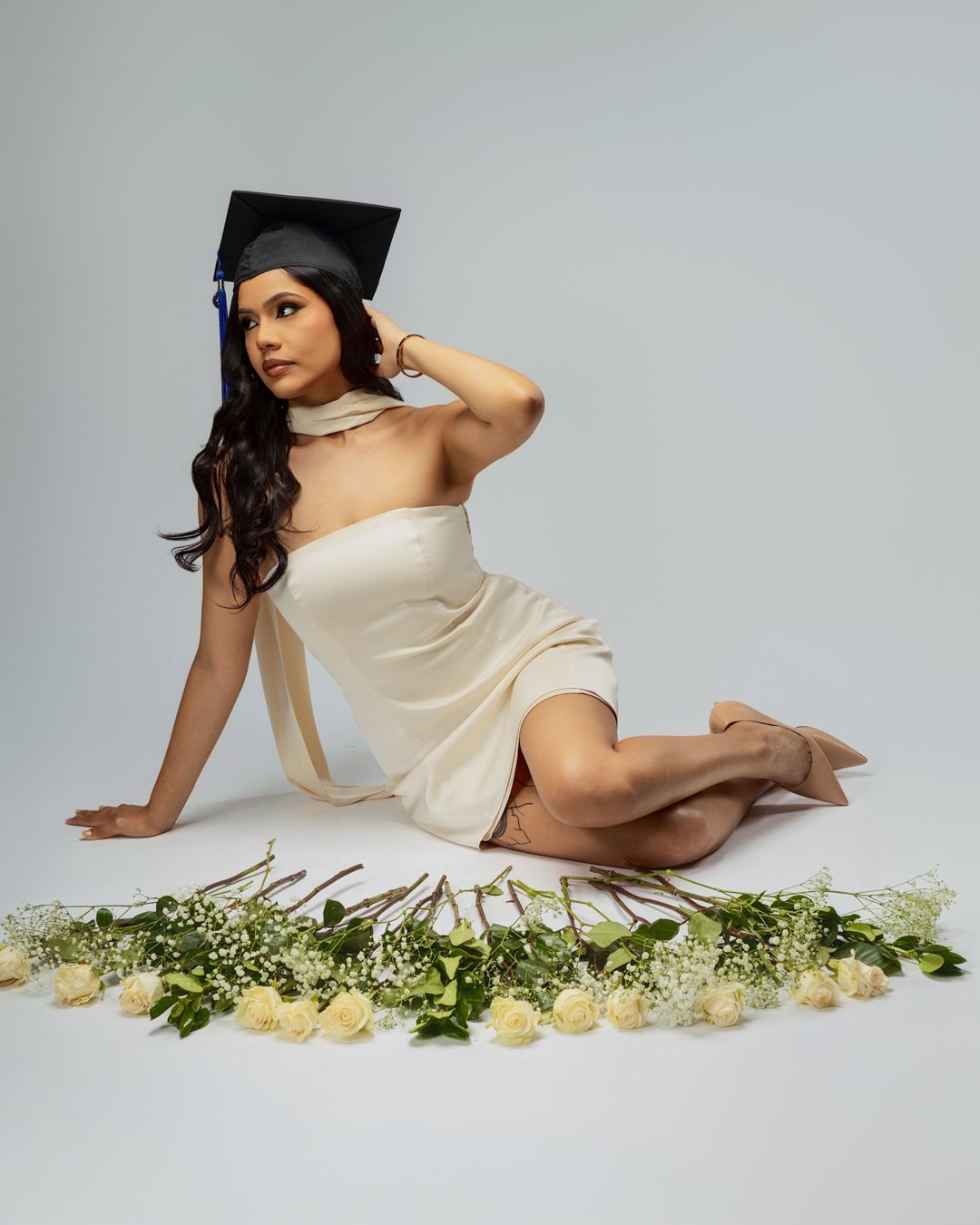 Graduation photo session in-studio with creative posing and soft lighting by Tampa Photographer Rashad Gilmore