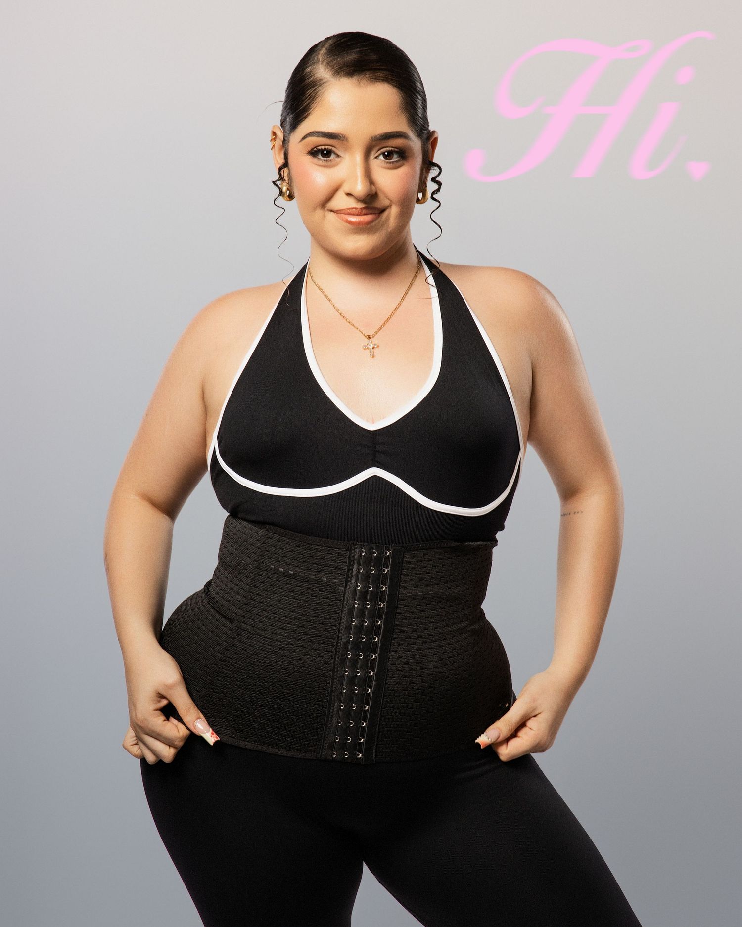 Model wearing black and white trim athletic wear shows various poses in studio setting.
