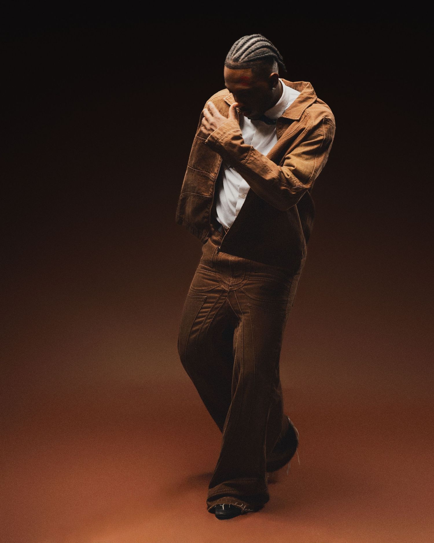 Creative portrait of Tampa client posing confidently in studio lighting by Rashad Gilmore Photography