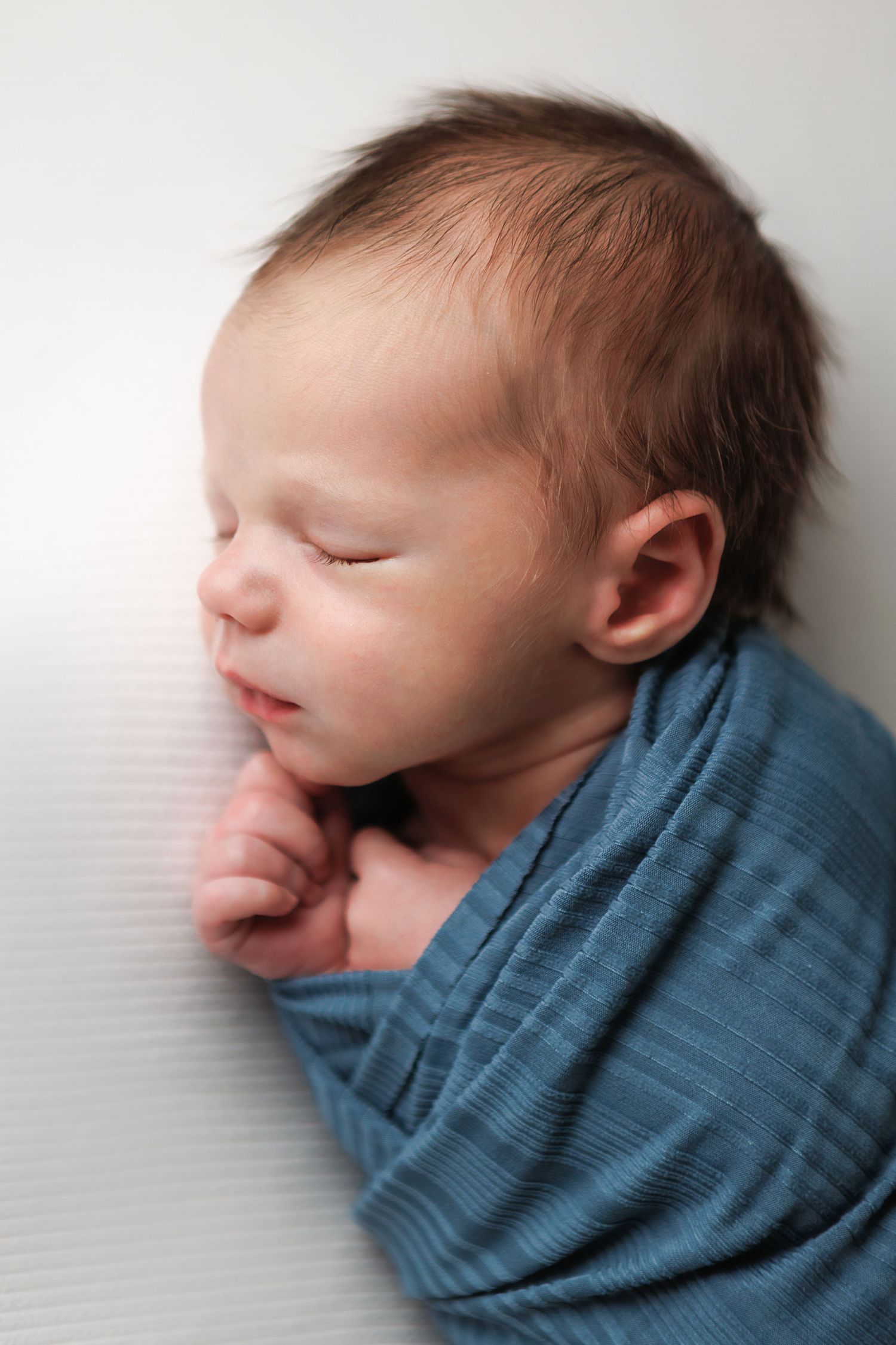 Timeless newborn baby portrait photographed at a professional portrait studio in Salem, New Hampshire